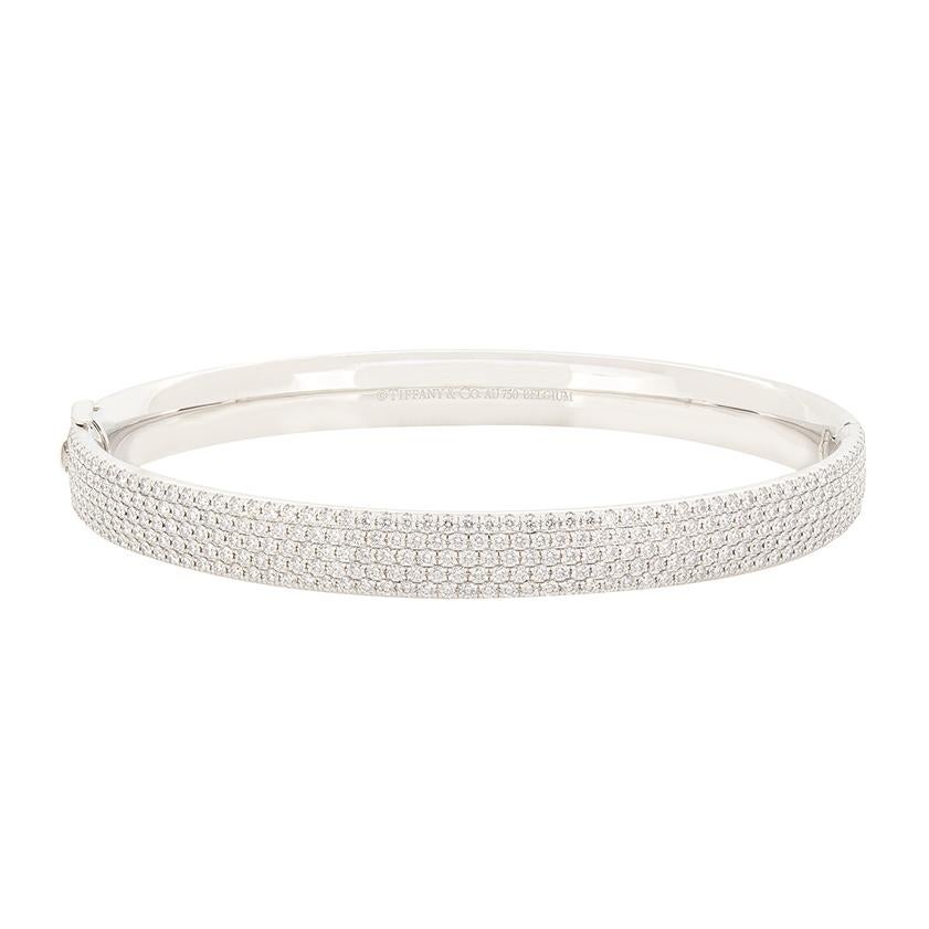 From Tiffany & Co.'s 'Metro' collection, comes this beautiful five row diamond bangle. A total of 2.12 carat in sparkling round brilliant diamonds are presented across five rows across the front half of the bangle. All of matching quality, the