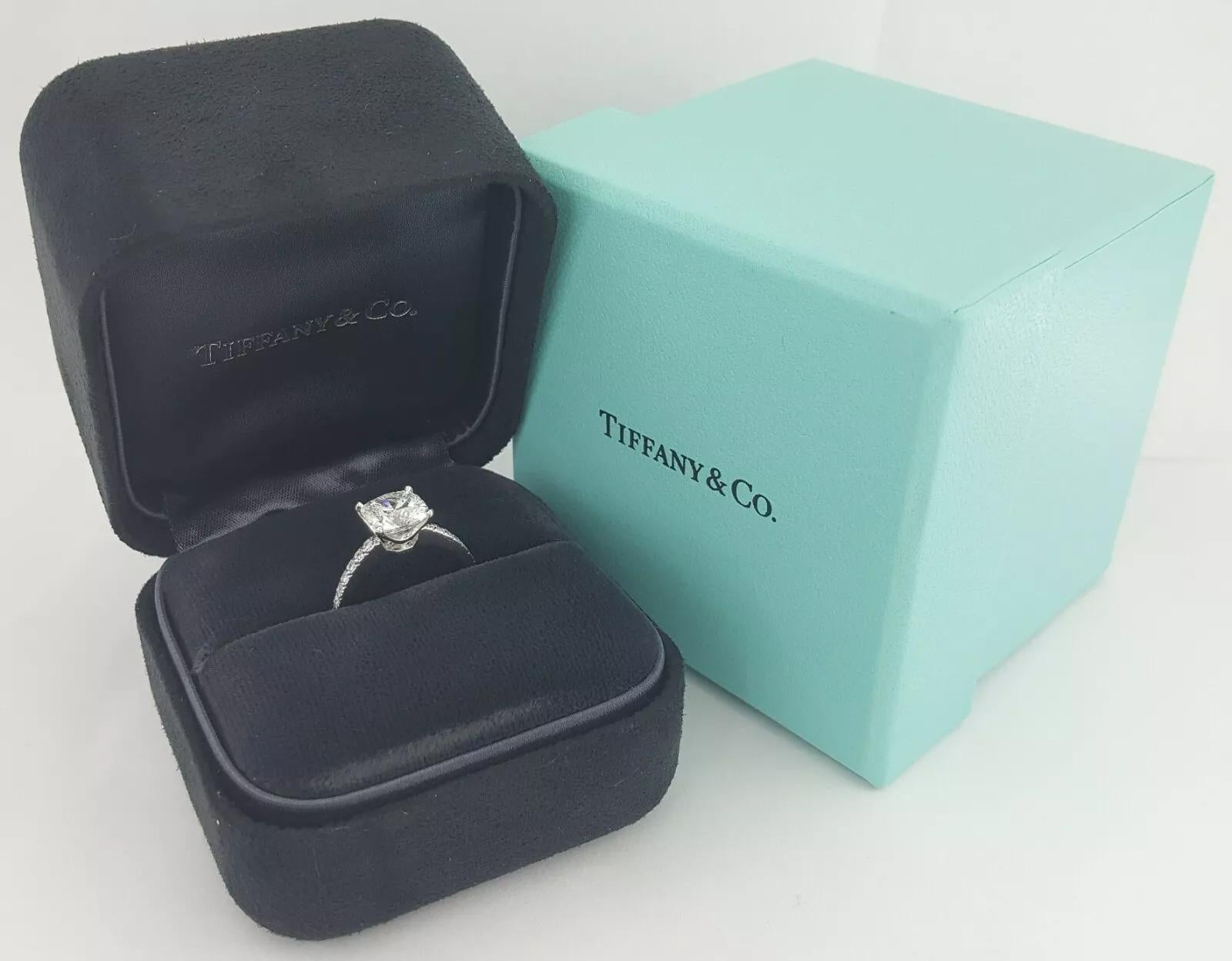An extraordinary and rare creation by Tiffany & Co., this authentic NOVO engagement ring features a stunning 2.01 carat cushion brilliant cut diamond at its center—exclusively cut and sold by Tiffany & Co. The center stone is graded G color, VVS1