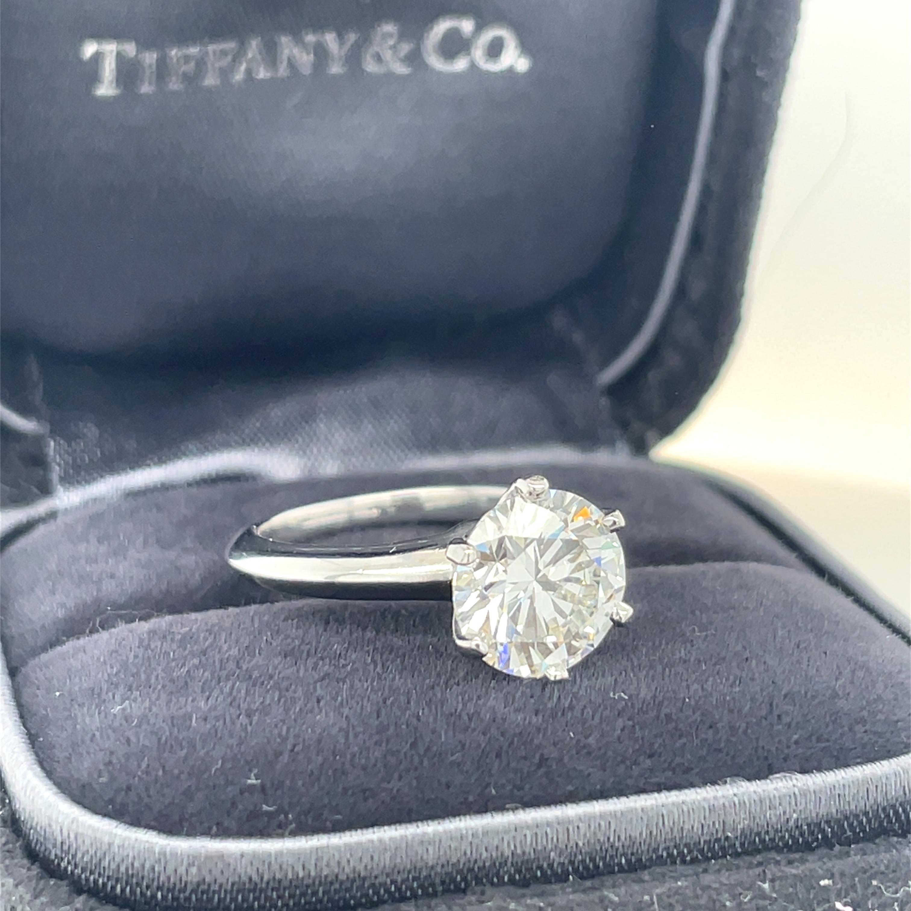 Diamond cut: Round Brilliant 
Carat: 2.30 carats
Color: G color, VS1 clarity, 
Clarity: VS1
Cut: Excellent
Polish: Very Good
Symmetry: Excellent

Metal: Platinum
Ring size: 4 1/4
Stamp: TIFFANY&CO. Pt950 (Serial number) 2.30CT.
Gross weight: 5.60