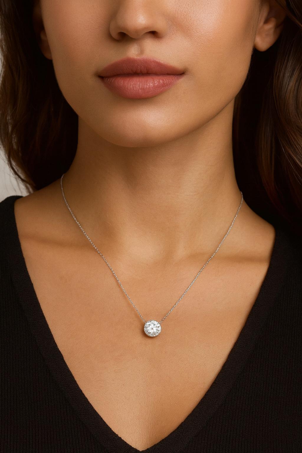 Tiffany & Co. 2.49 Carat Diamond Soleste Halo Platinum Pendant Necklace

An extraordinary example of Tiffany & Co.’s craftsmanship, this pendant features a 2.49 carat round brilliant diamond, graded H color, VVS2 clarity, and boasting the coveted