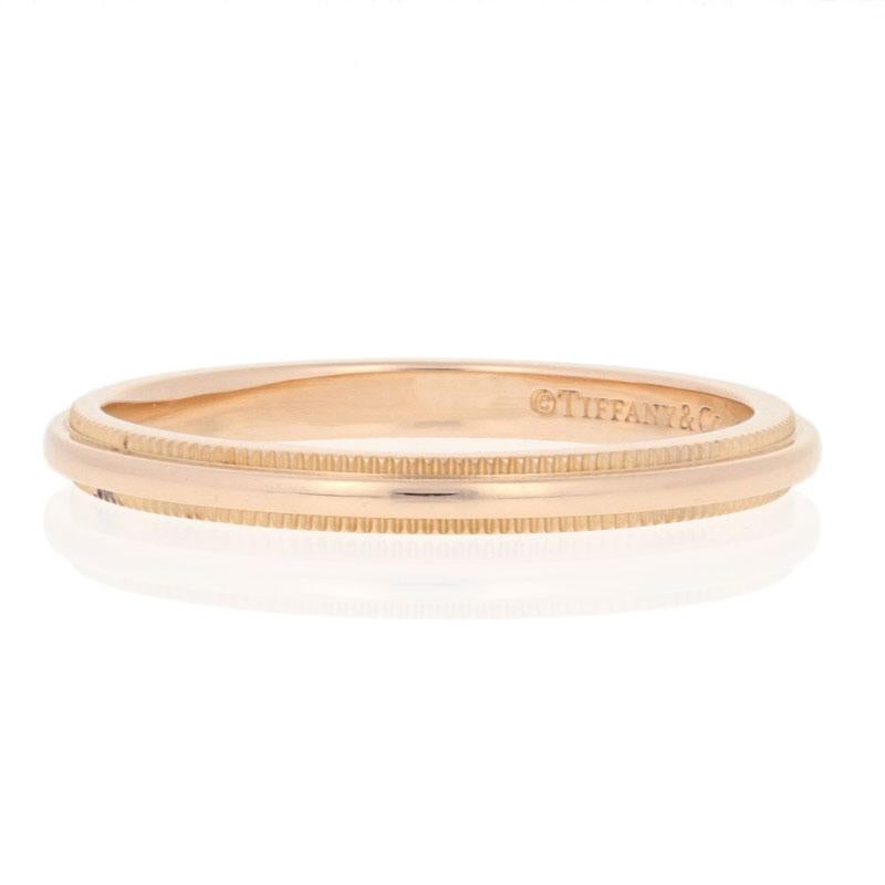Originally retailing for $750, this designer ring is being offered here for a much more wallet-friendly price.  

This ring is a size 6 1/2.

Brand: Tiffany & Co.

Metal Content: Guaranteed 18k Gold as stamped
Style: Wedding Band without Stones
Face