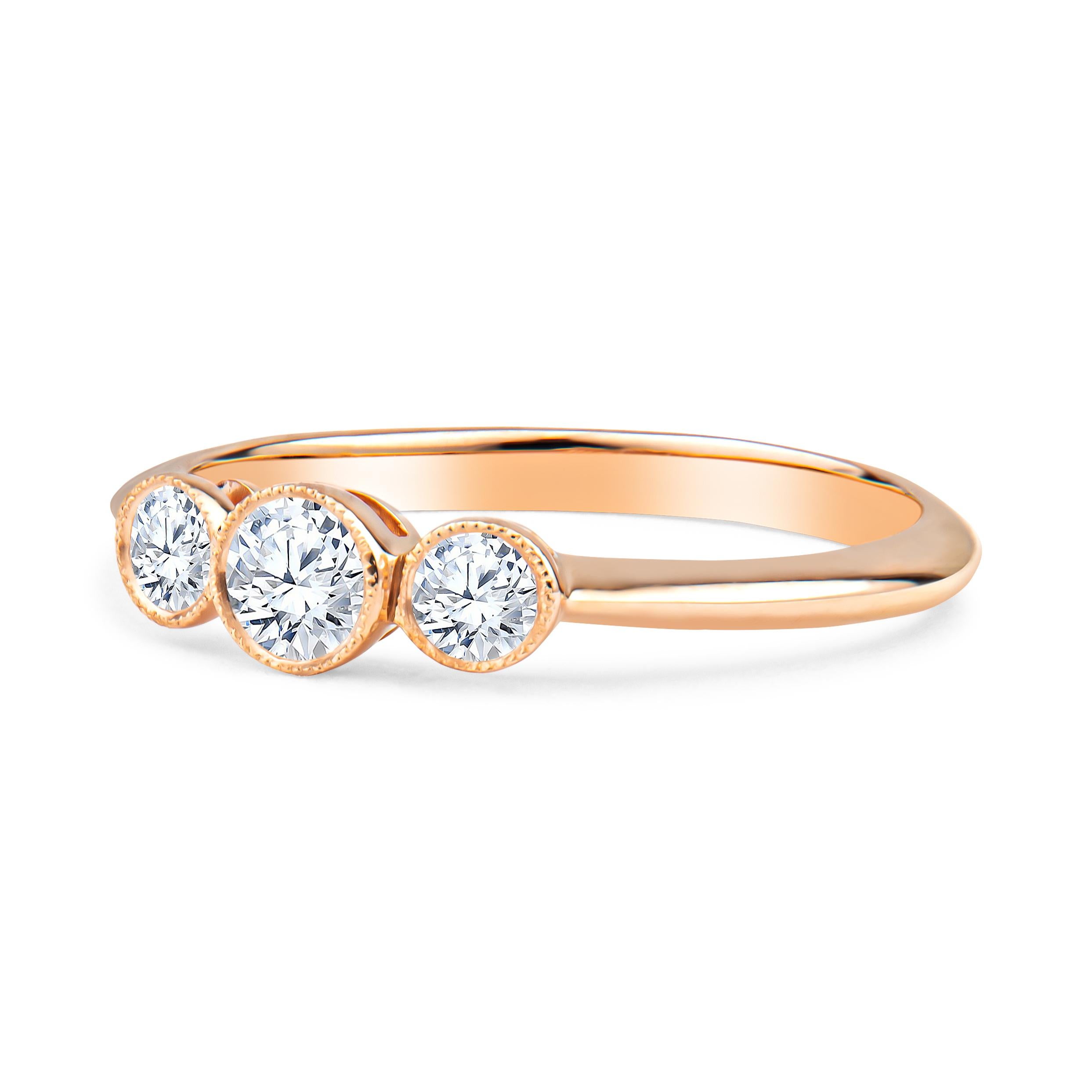 Tiffany & Co. 3-stone rose gold milgrain bezel ring, 0.33ctw in 3 round diamonds of D-F color, VS2-VVS1 clarity, in 18kt rose gold ring. MSRP is approximately $3500. Size 6.5