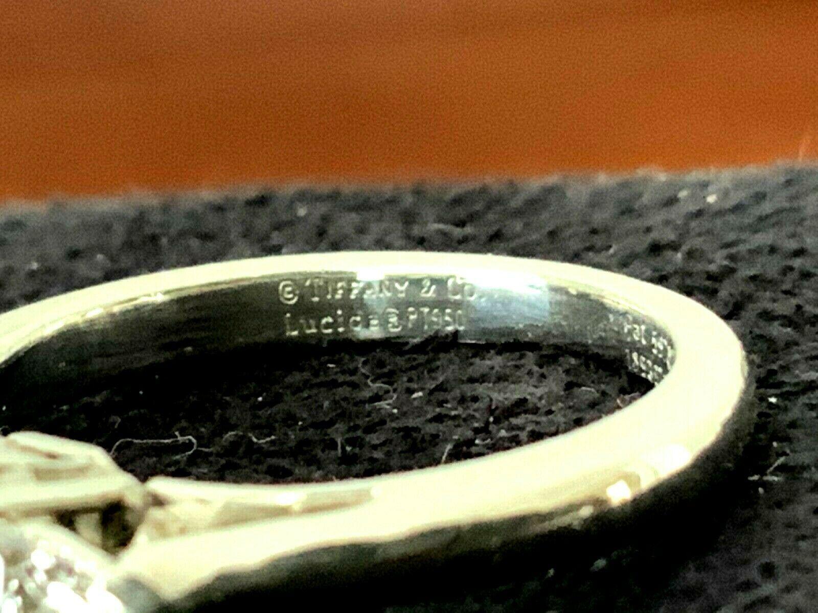 Tiffany & Co. 3-Stone Diamond Engagement Ring .79 Carat F VVS2 5