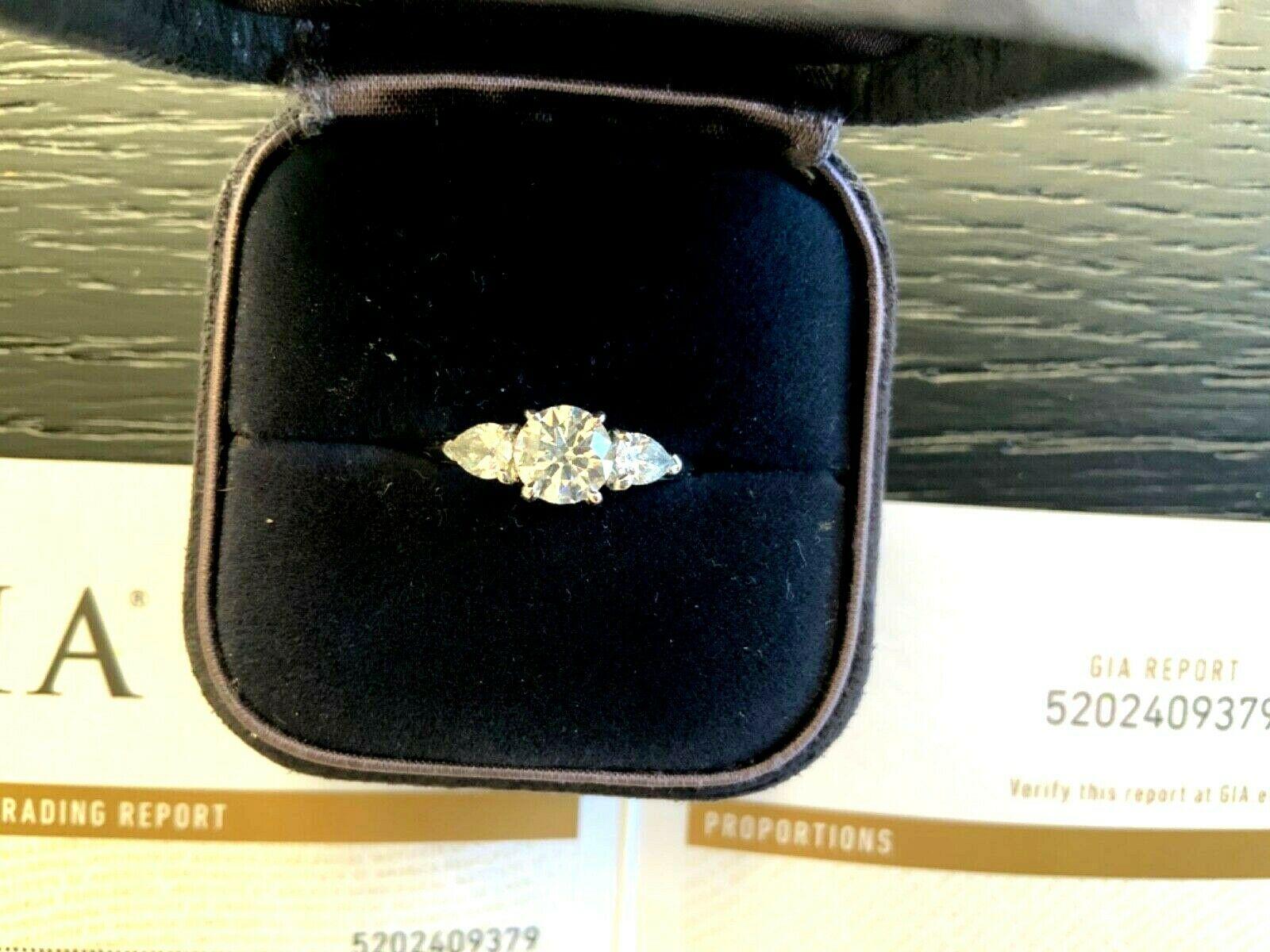 Tiffany & Co. 3-Stone Round and Pear Diamond Engagement Ring .77 Carat G VS2 7