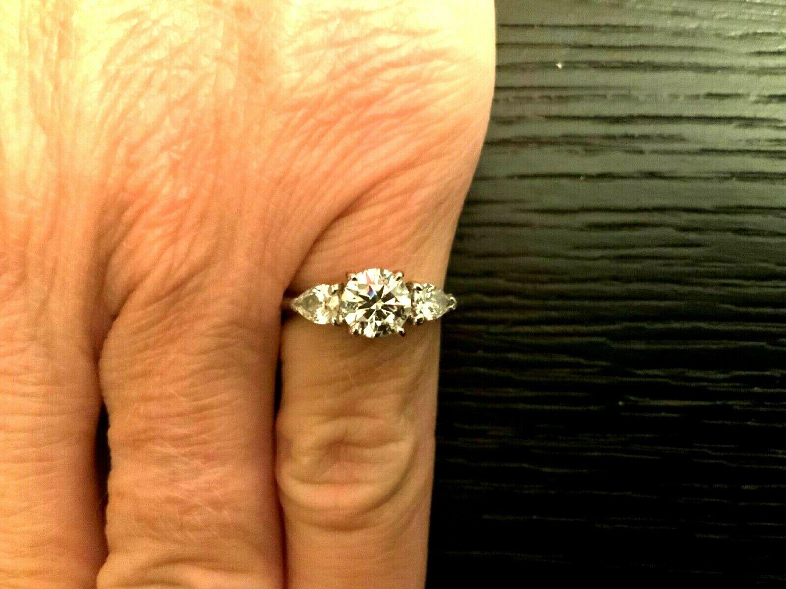 Tiffany & Co. 3-Stone Round and Pear Diamond Engagement Ring .77 Carat G VS2 In Excellent Condition In Middletown, DE