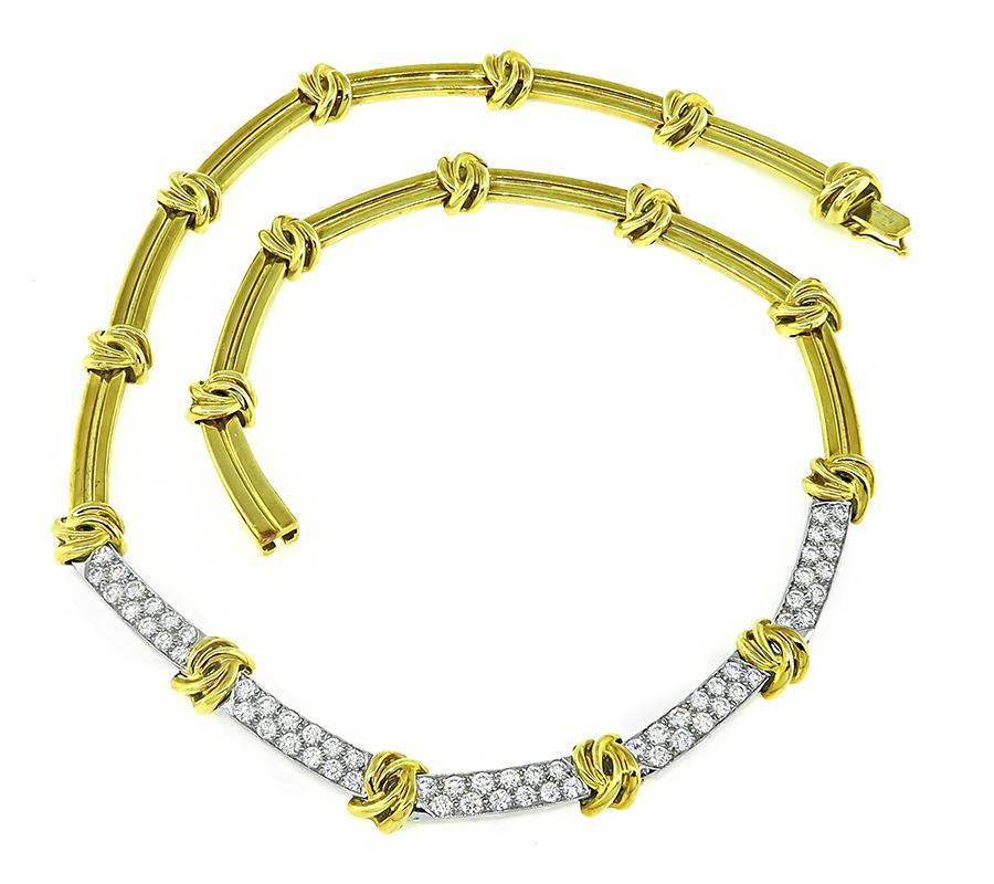 This is a charming 18k yellow and white gold necklace by Tiffany & Co. The necklace is set with sparkling round cut diamonds that weigh approximately 3.00ct. The color of these diamonds is E-F with VVS clarity. The necklace measures 8mm in width and