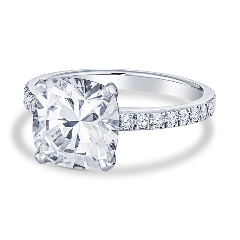 This beautiful ring features a 3.11 carat cushion cut diamond, G VVS2, set in platinum and accented by round diamonds on the band. It is a size 6 but can be resized upon request. 
Measurements: 9.01 x 8.86 x 6.01mm
Condition: Excellent. No visible
