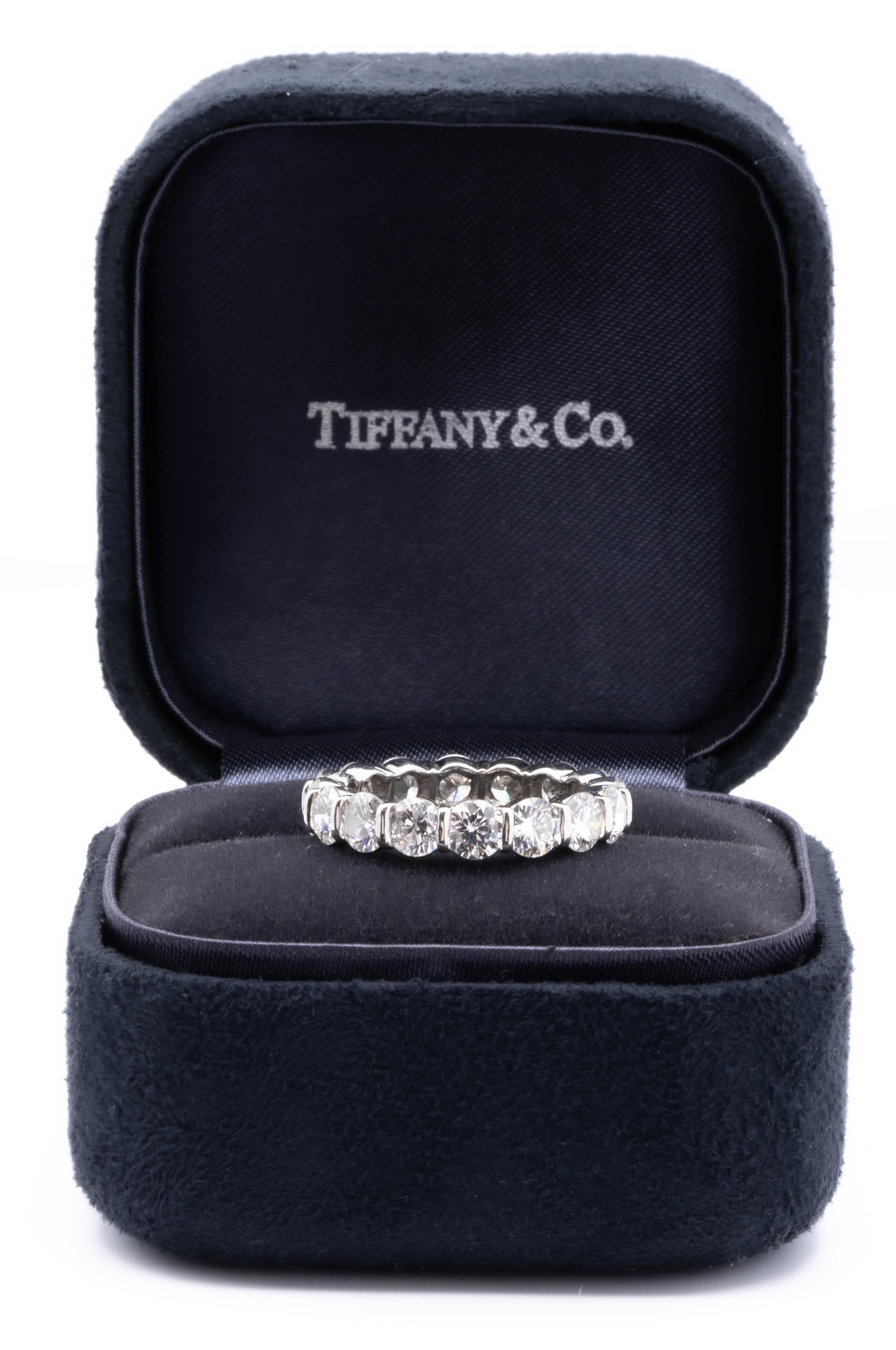Tiffany & Co. Vintage Full Circle Eternity Ring finely crafted in Platinum with 16 Bar-Set round brilliant cut diamonds, weighing approximately  3.20 carats total weight , F-G color and VVS-VS clarity.
Band measures 4mm in width approximately.