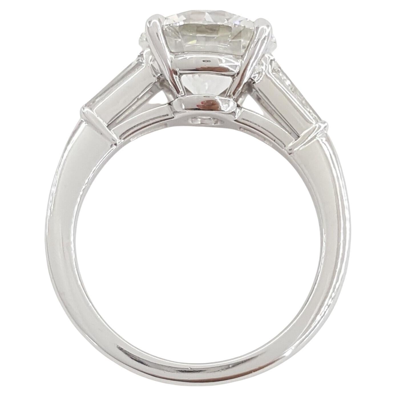 Tiffany & Co.  Platinum Round Brilliant Cut Diamond Solitaire Engagement Ring. 
The main diamond is a Round Brilliant Cut diamond weighing 3.40 ct, G in color, VVS2 in clarity. The center stone has a excellent Cut, excellent Polish, excellent