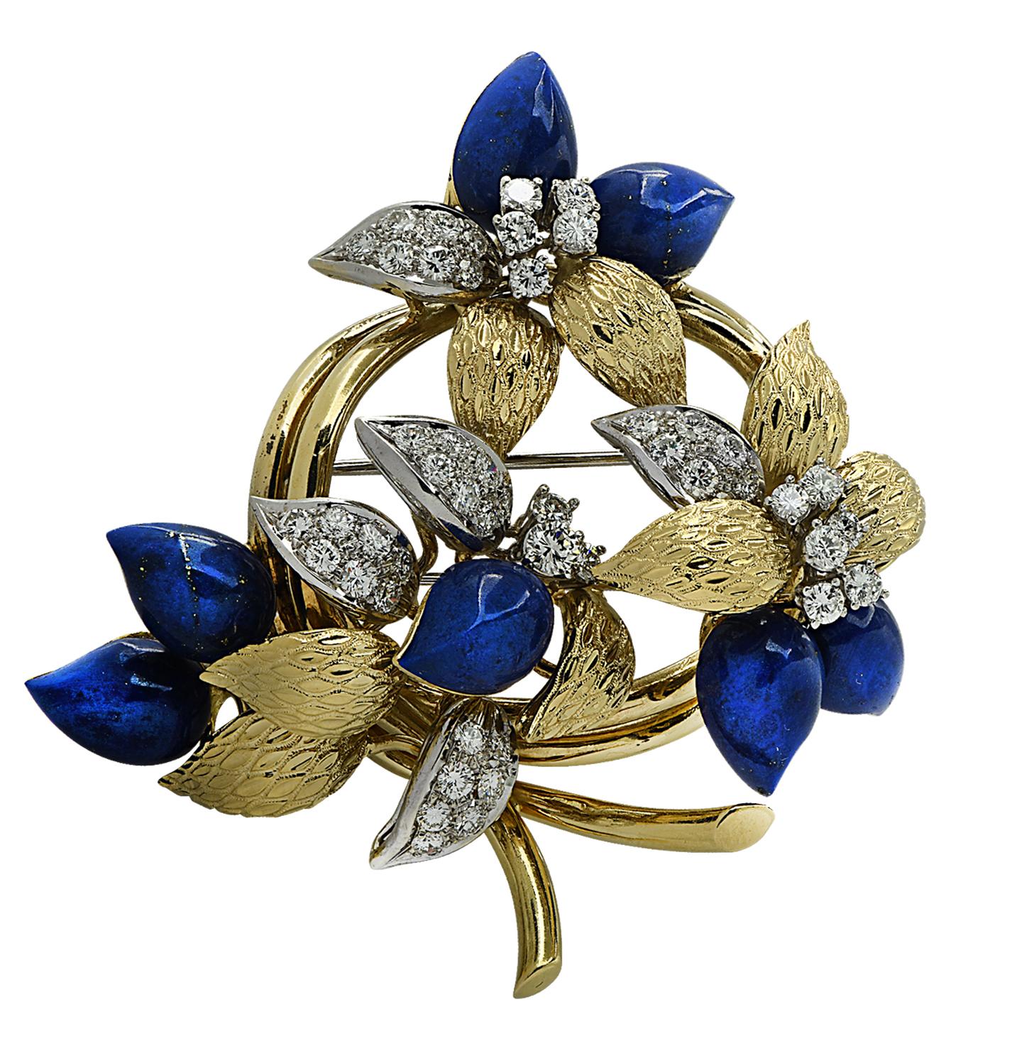 Tiffany & Co. Brooch Pin crafted in 18 karat yellow and white gold featuring 49 round brilliant cut diamonds weighing approximately 3.51 carats total F-G color, VS clarity, and 7 petal shaped Lapis Lazuli cabochons. The diamonds and lapis are