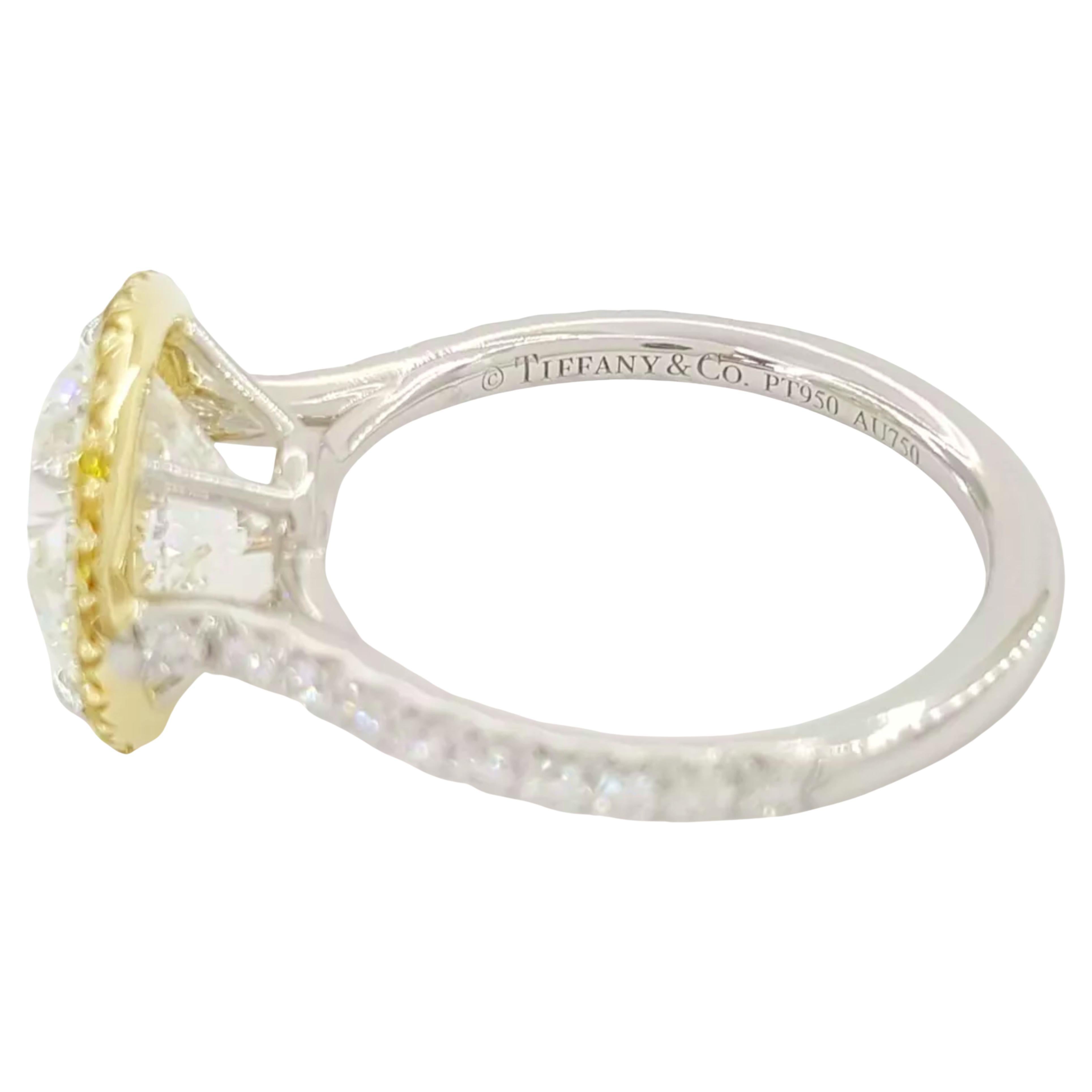 Tiffany & Co. 3.55 ct Soleste Platinum and 18k Yellow Gold Round Brilliant Cut Diamond Halo Engagement Ring, a stunning masterpiece of luxury and elegance. The ring weighs 5.2 grams and is sized at 6, featuring a dazzling natural 3.07 ct Round