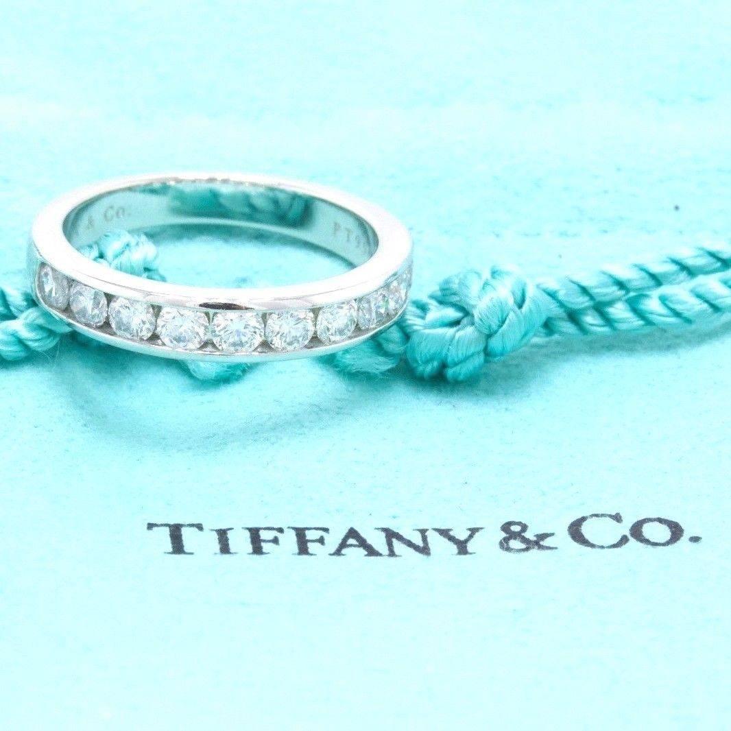 Tiffany & Co. 
Style:  Channel Set Wedding Band - Half Circle
Sku Number:  18409739
Metal:  Platinum PT950
Width:  3.9 MM
Size:  7.5 - Sizable
Total Carat Weight:  0.81 TCW
Diamond Shape:  Round Brilliant Diamonds
Diamond Color & Clarity:  F /