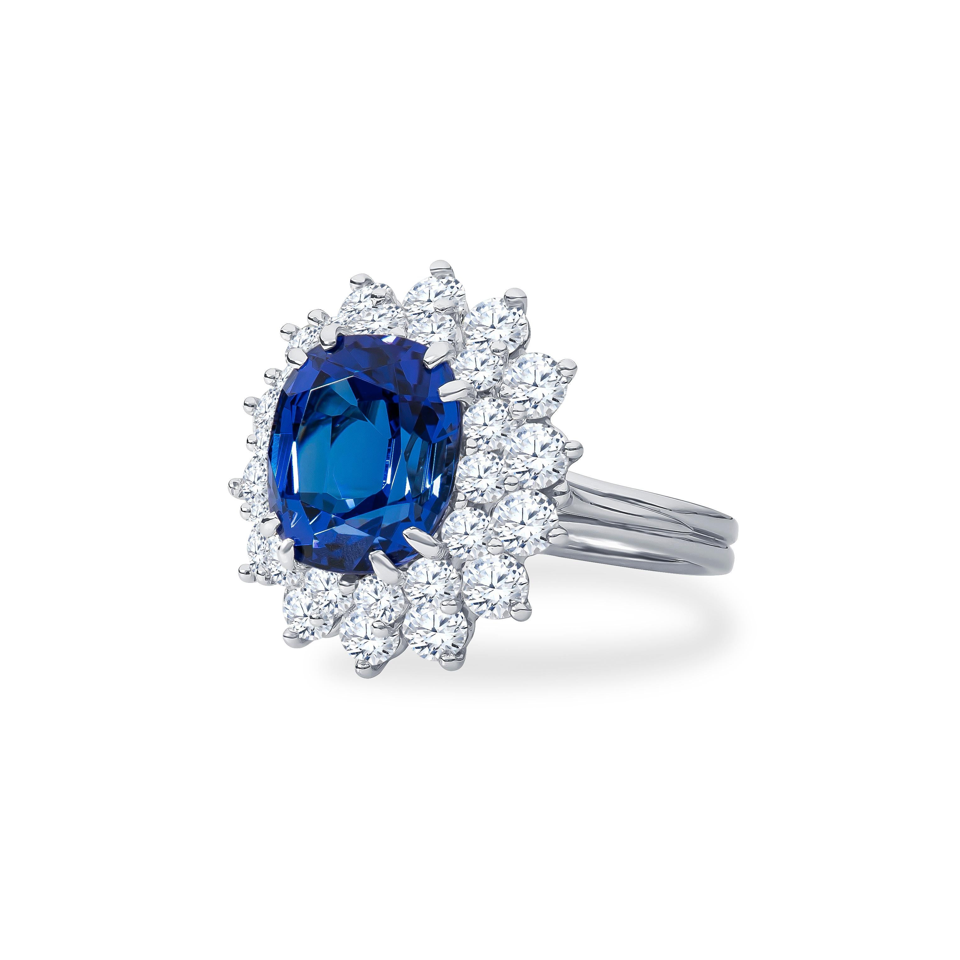 Stunning Tiffany and Co. Tanzanite ring with approximately 3.90 carat total weight & 1.60 carat total weight in fine round brilliant diamonds. Tanzanite is a highly desirable nearly pure blue hue and extremely fine. Ring size 5.25, size may be