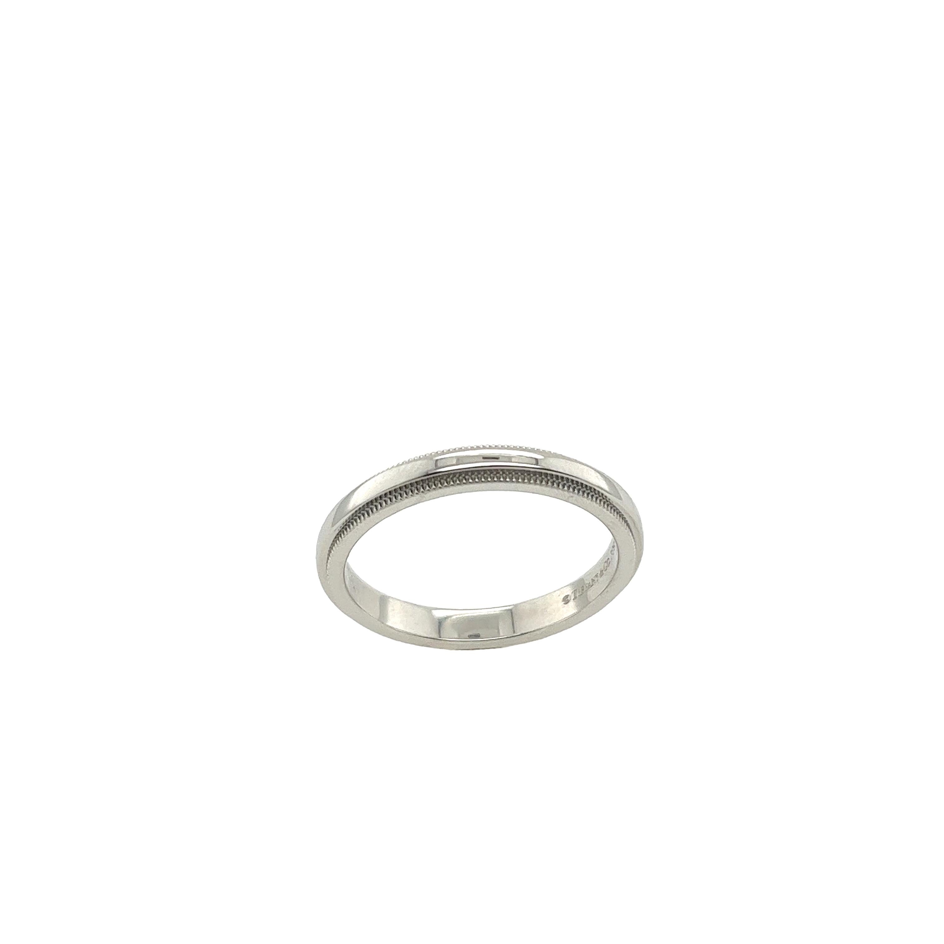 The Tiffany & Co. 3mm Together milgrain platinum wedding band is a stunning symbol of enduring love and commitment. Tiffany & Co. wedding bands are often crafted with a comfort fit design, ensuring maximum comfort for daily wear. The timeless design