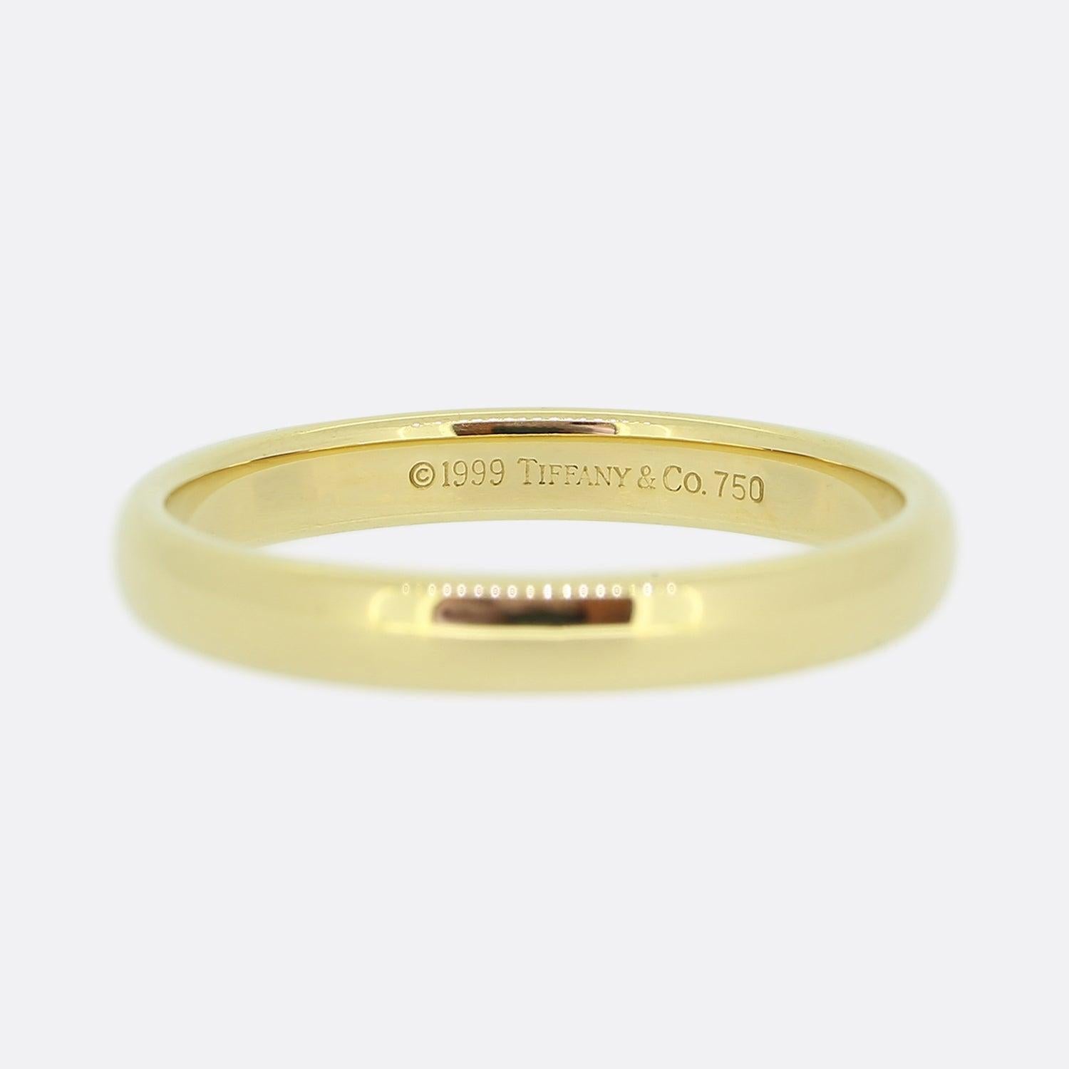 Here we have a classic 18ct yellow gold wedding band from the world renowned jewellery designer, Tiffany & Co.

Wear one as a wedding band or two stacked together for a modern look. 

Condition: Used (Very Good)
Weight: 3.8 grams
Ring Size: R 1/2