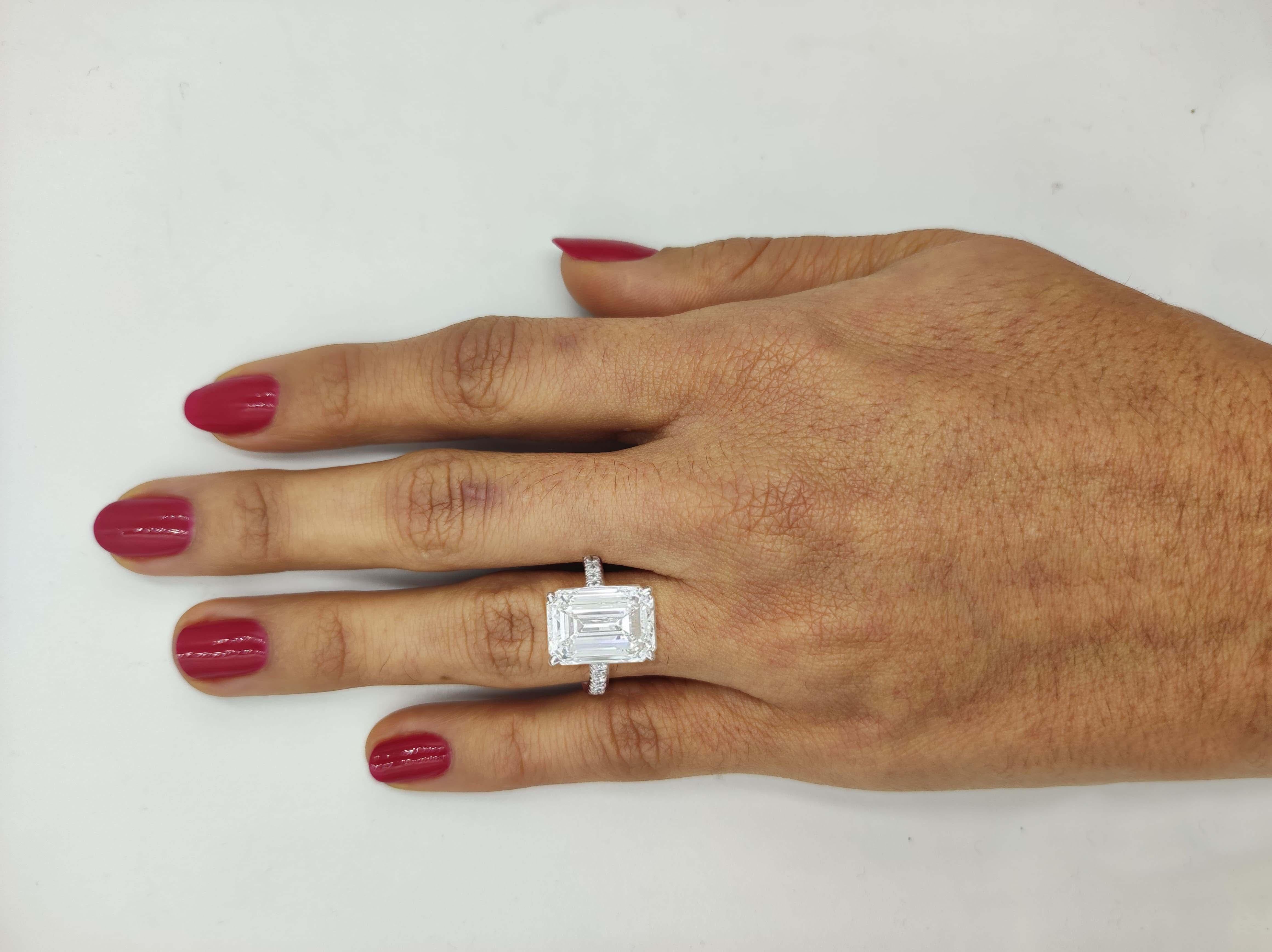 4 Carat Emerald Cut Diamond Ring On Hand
