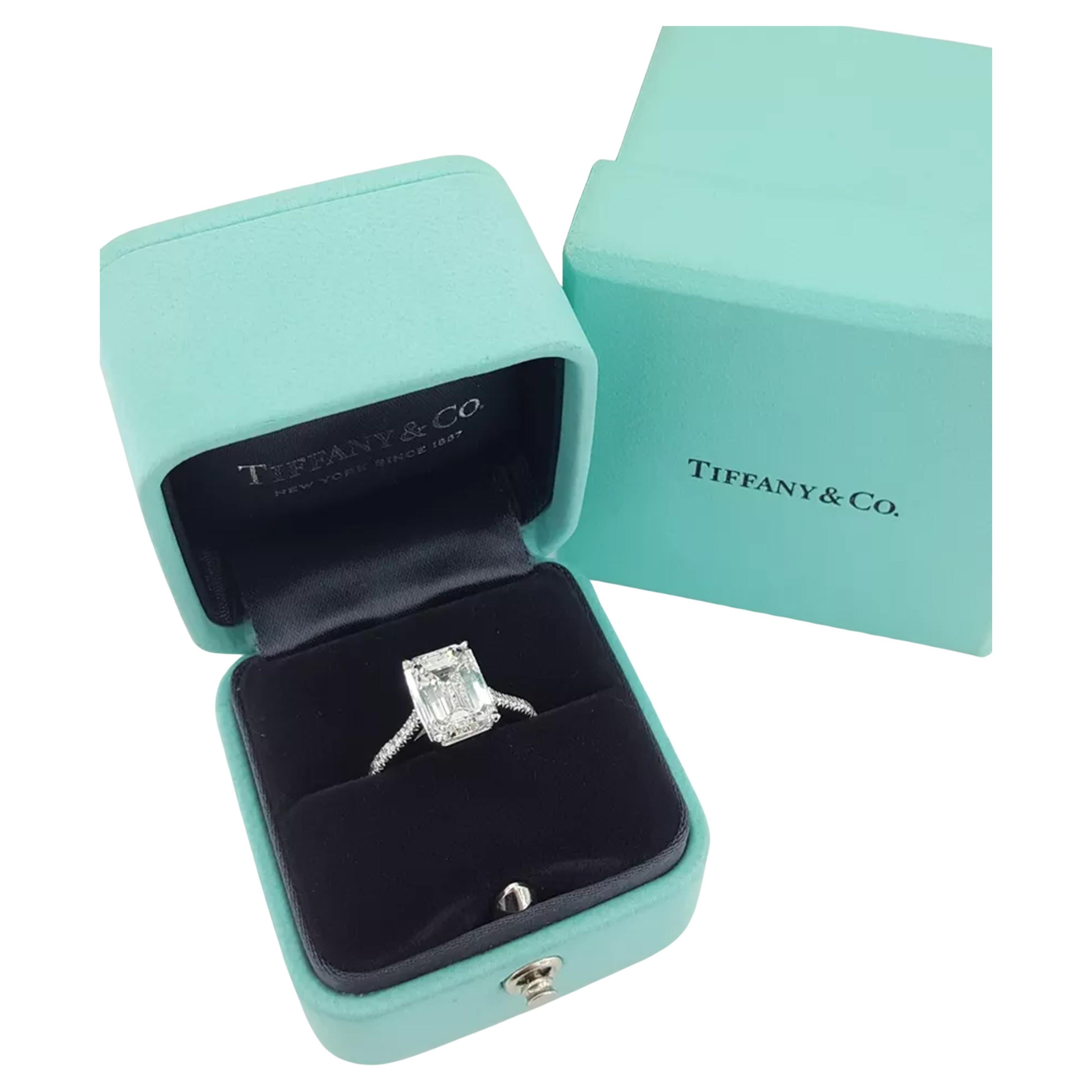  Tiffany & Co. engagement ring featuring a total diamond weight of 4.18 carats. The ring weighs 5.2 grams and is a size 6. The center stone is a natural emerald cut diamond weighing 4.02 ct, with an F color rating and VVS1 clarity. It has an