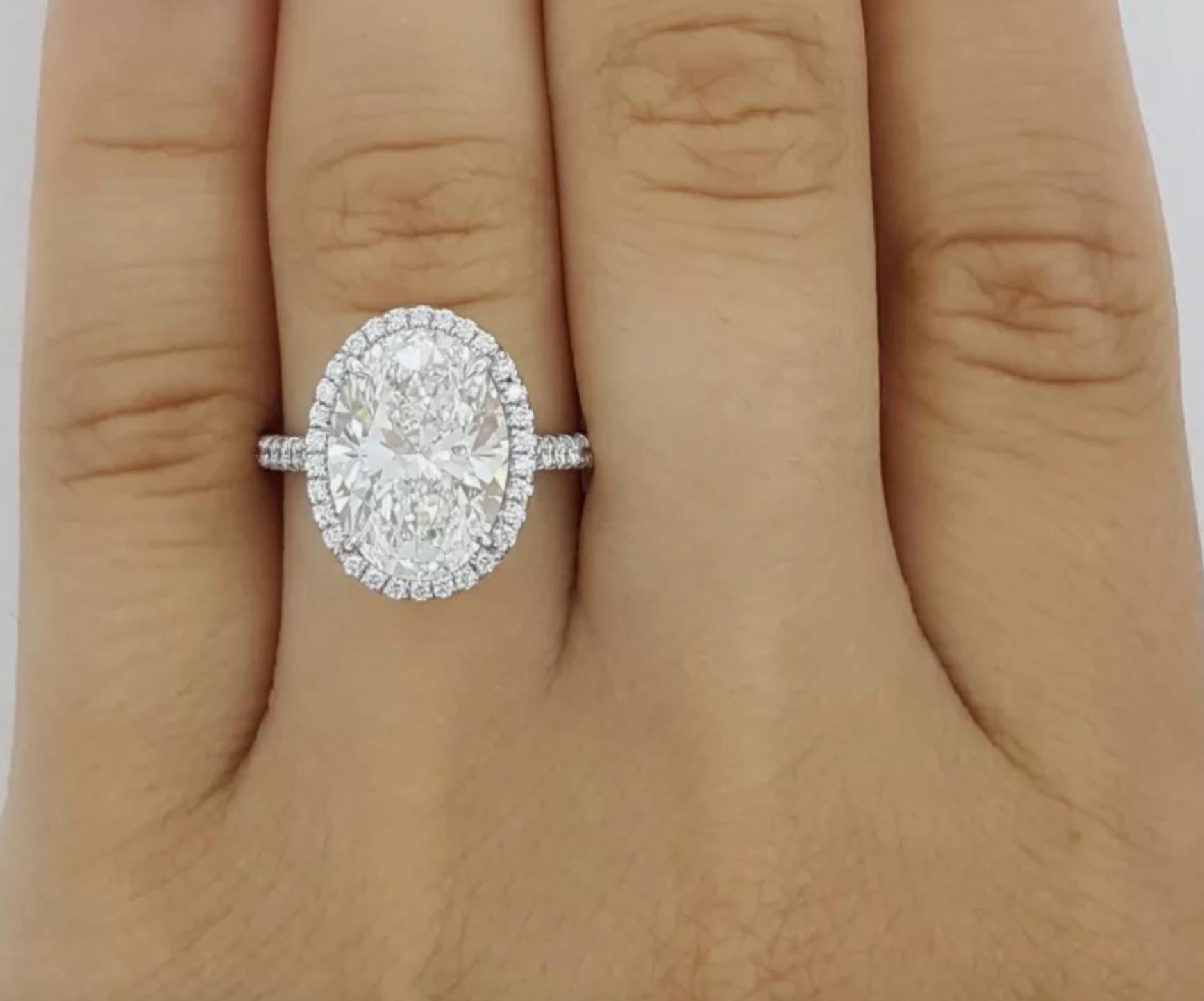 Diamond cut: Oval Brilliant 
Carat: 4.06 carats
Measurements: 12.39 x 9.00 x 5.67 mm
Color: H
Clarity: VVS1
Cut: Excellent
Polish: Excellent
Symmetry: Excellent
Inscription: T&Co. (Serial number) on crown 

Small Diamonds
Carat: 0.32 carat