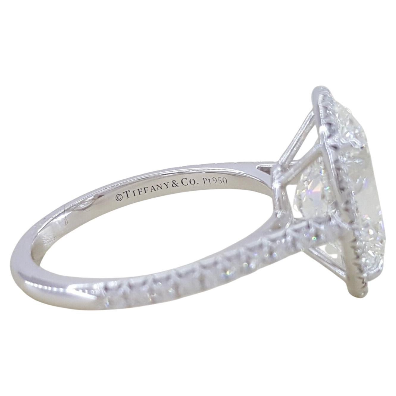 Tiffany & Co. 4.38 ctw Soleste Oval Brilliant Cut Diamond Platinum Halo Engagement Ring.

The ring weighs 5 grams, size 6, the center is a Natural Oval Brilliant Cut diamond weighing 4.06 ct, H in Color, VVS1 in Clarity w/ Specifications: 12.39 x