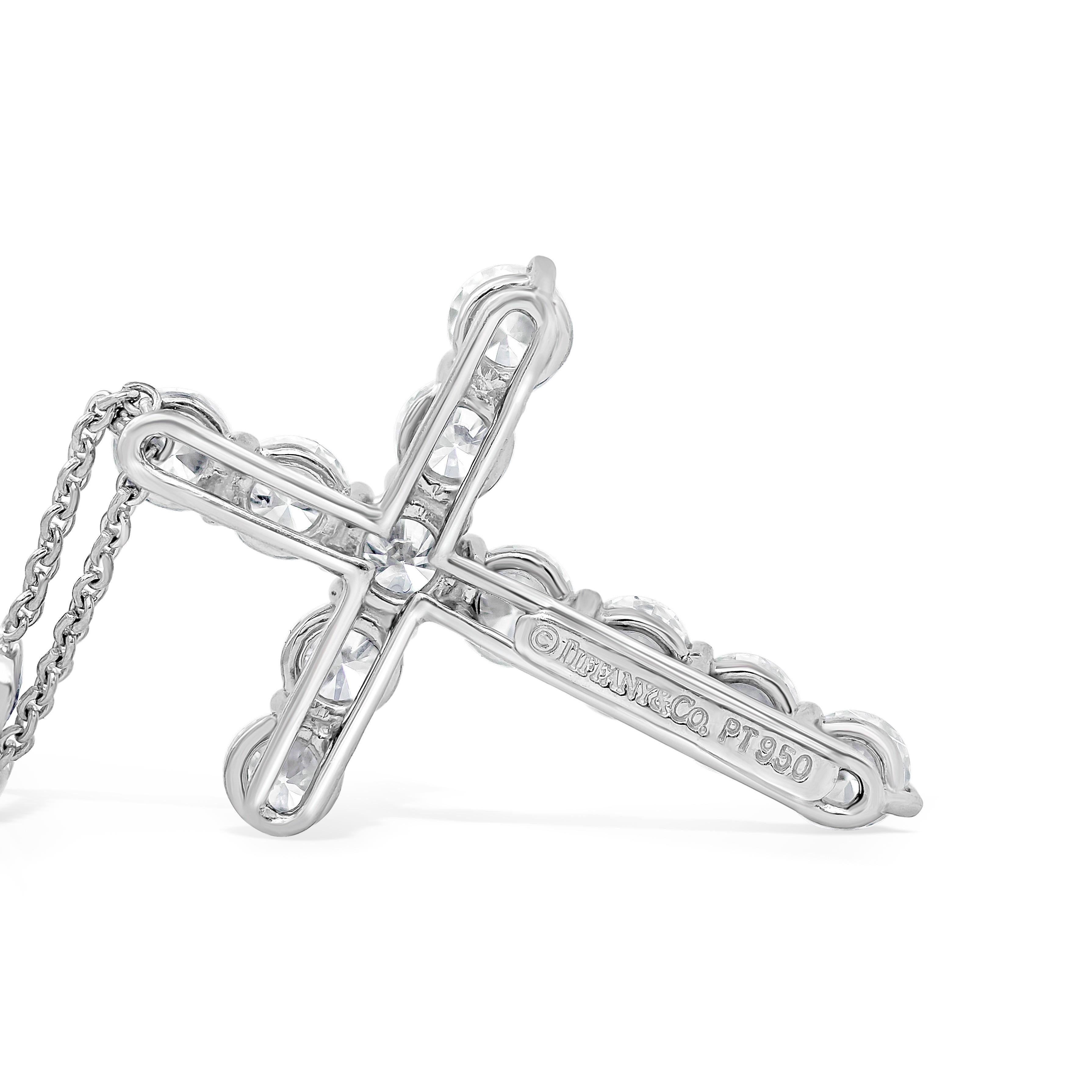This is a very brilliant and gorgeous piece made and signed by Tiffany & Co. Showcases a 2 carat diamond cross suspended on an elegant diamonds by the yard necklace. The diamonds by the yard necklace is set with 2.75 carats total of diamonds.