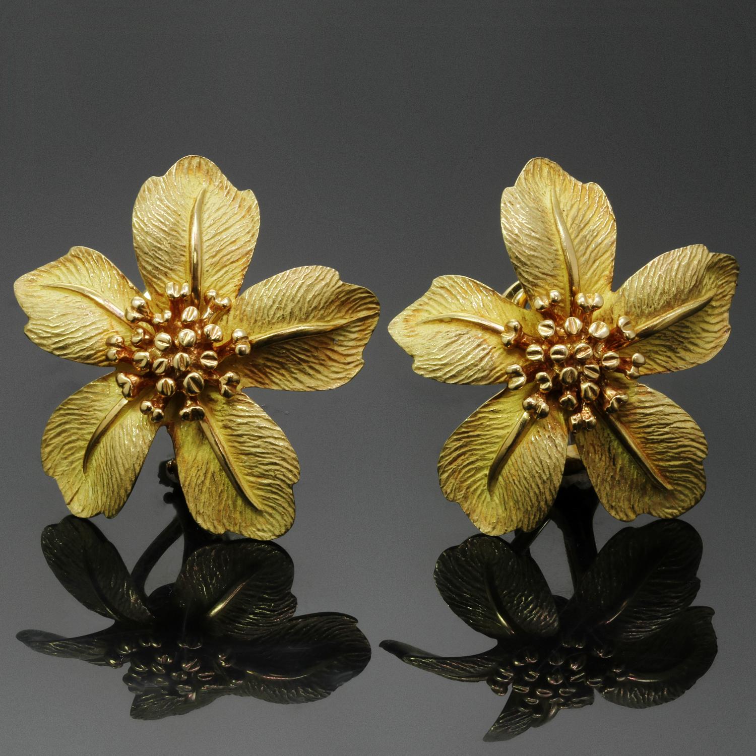 These gorgeous Tiffany & Co. flower earrings feature five stylized petals in etched, satin-finished 18k yellow gold centering elegant stamens. Completed with omega clip-on backs with posts. Made in United States circa 1980s. Measurements: 1.06
