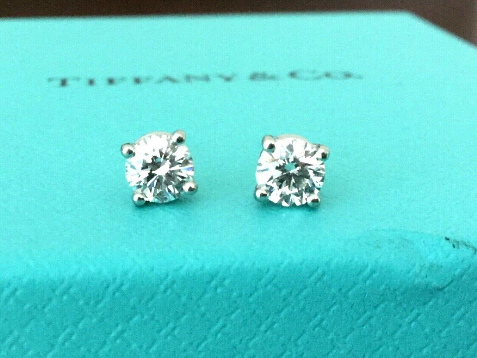 Offered for your consideration is a like new set of platinum and diamond Tiffany & Co Stud earrings with the original Tiffany diamond certificates.  It is super rare to find a set of Tiffany stud earrings with the original paperwork as 99% of