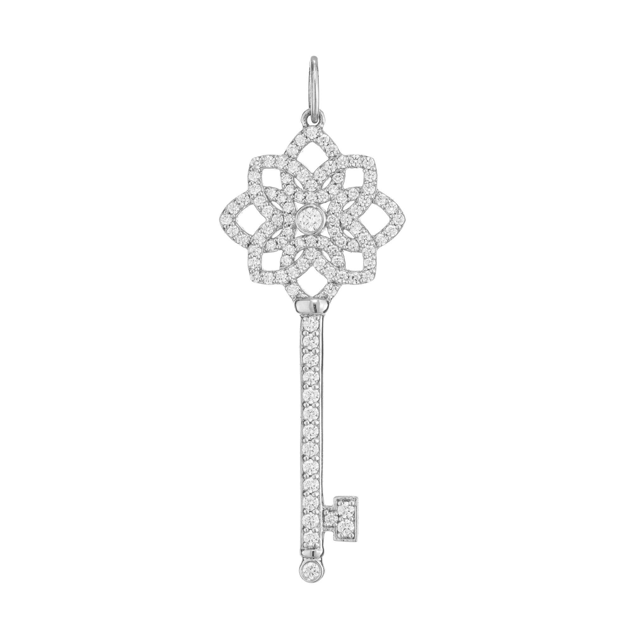 Excellent Tiffany & Co platinum diamond key pendant, medium size, 1.5 Inches long. This retired style is adorned with 107 brilliant cut diamonds with a approximate total weight of .50ccts. According to Tiffany's, their iconic Key pendants are