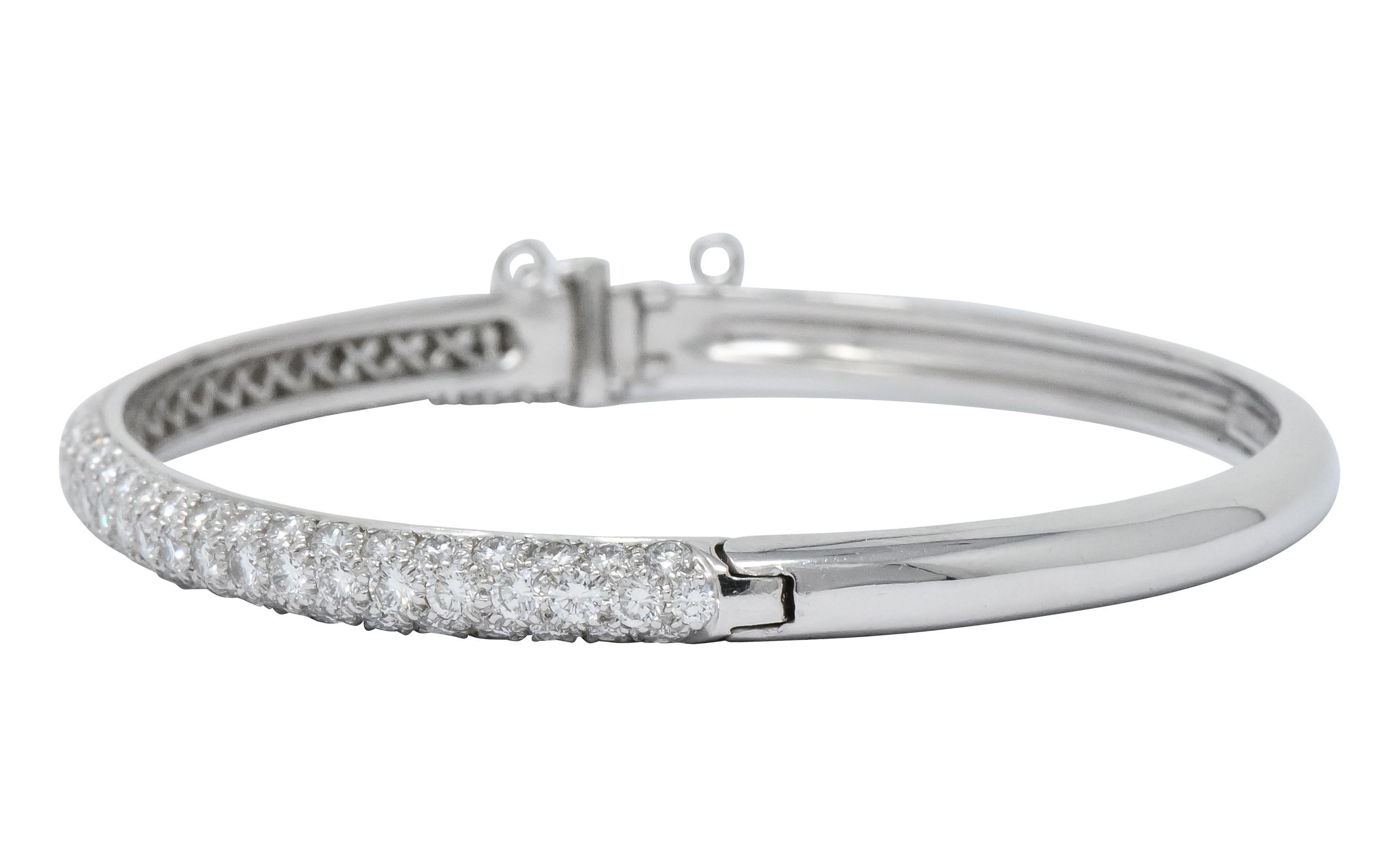 Hinged style bangle

Top section features pavé set round brilliant cut diamonds, weighing approximately 5.00 carats total, G/H color and VS clarity

Concealed clasp with fold-over safety and safety chain

Fully signed Tiffany & Co. and stamped PT950