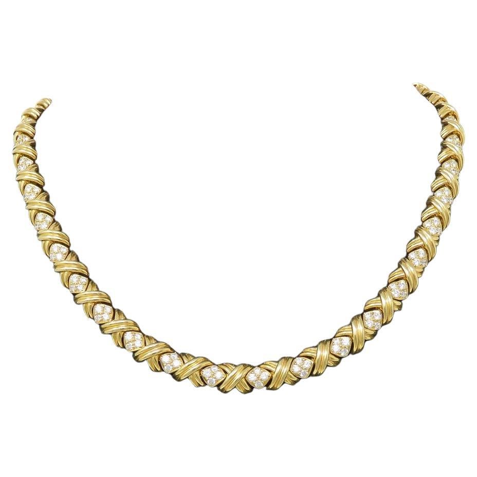 Tiffany & Co. Round Brilliant Cut Diamond 18k Yellow Gold Choker Necklace

5.5ct TW, most about G-H and VS range

Necklace 16 inches long and 8mm wide

Marked: T & Co. 750

Total Weight : 64.8 grams
