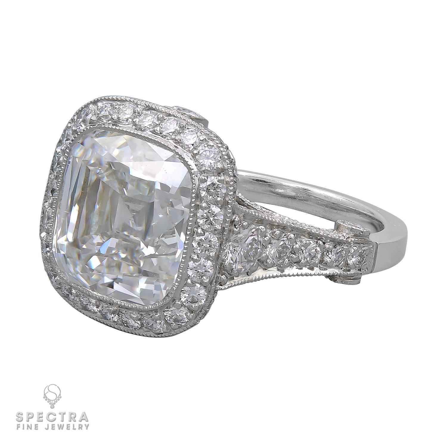 Experience timeless elegance with this stunning Tiffany & Co. Legacy ring. Crafted in luxurious platinum, this exquisite piece showcases a captivating 5.56 carat cushion-cut diamond, graded E for color and VS2 for clarity, offering brilliant sparkle