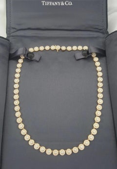 Tiffany & Co. 6 Carats diamond halo necklace is crafted in 18K rose gold
