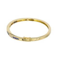 Tiffany & Co. .64 Carat Round Sapphire Diamond 18k Yellow Gold Bangle Bracelet