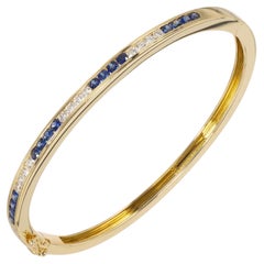 Tiffany & Co. .64 Carat Round Sapphire Diamond 18k Yellow Gold Bangle Bracelet