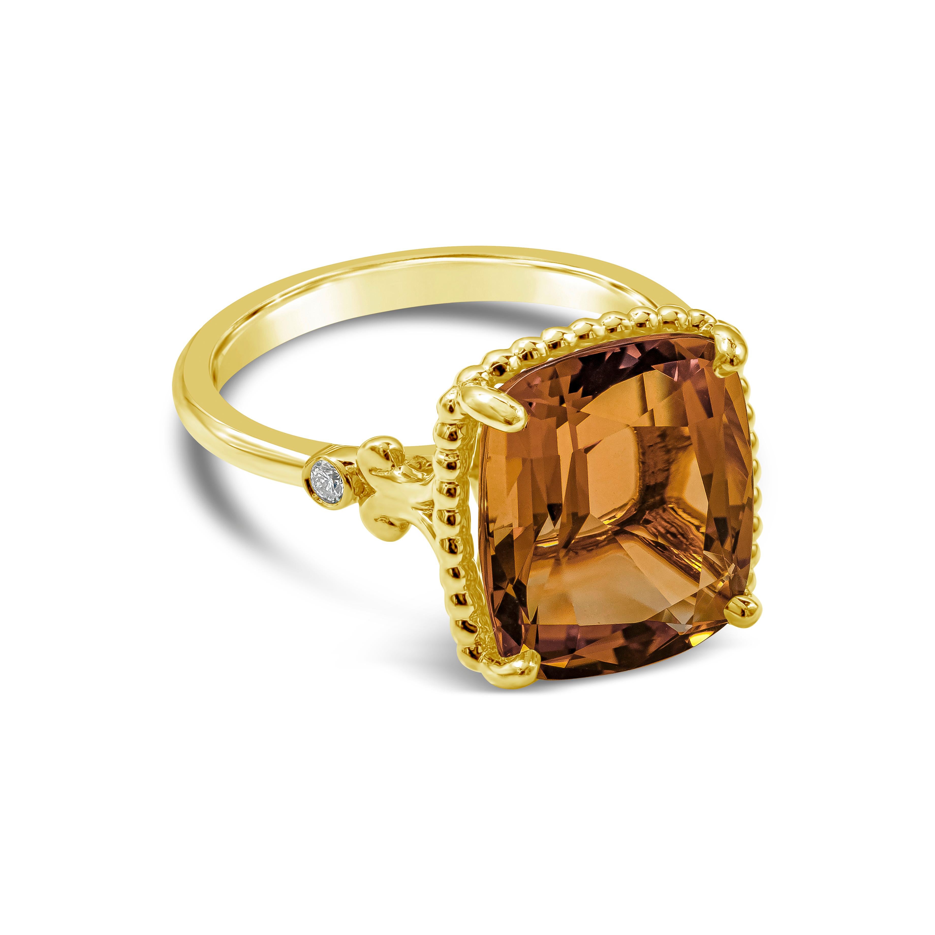 A beautiful cocktail ring showcasing a 6.50 carat cushion cut citrine, set in an 18k yellow gold basket and mounting. Band accented with diamonds on either side of the center stone. Comes with original Tiffany & Co. box.