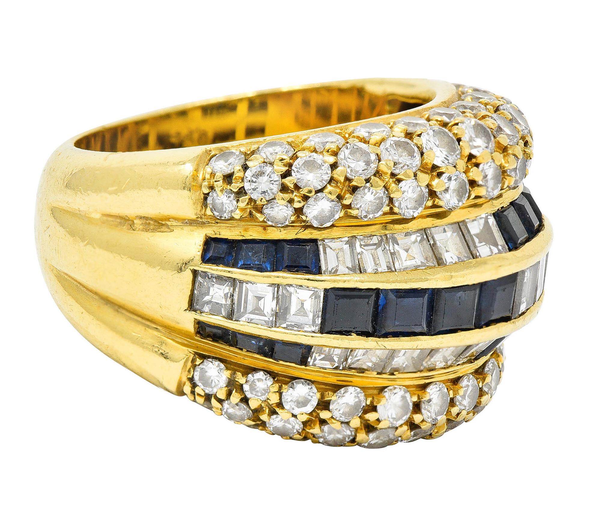Band ring features a deeply ridged design set with sapphires and diamonds

Center is channel set by calibrè cut sapphires and stepped cut diamonds

Sapphires are a well matched medium dark blue and weigh in total approximately 2.50 carats

Diamonds