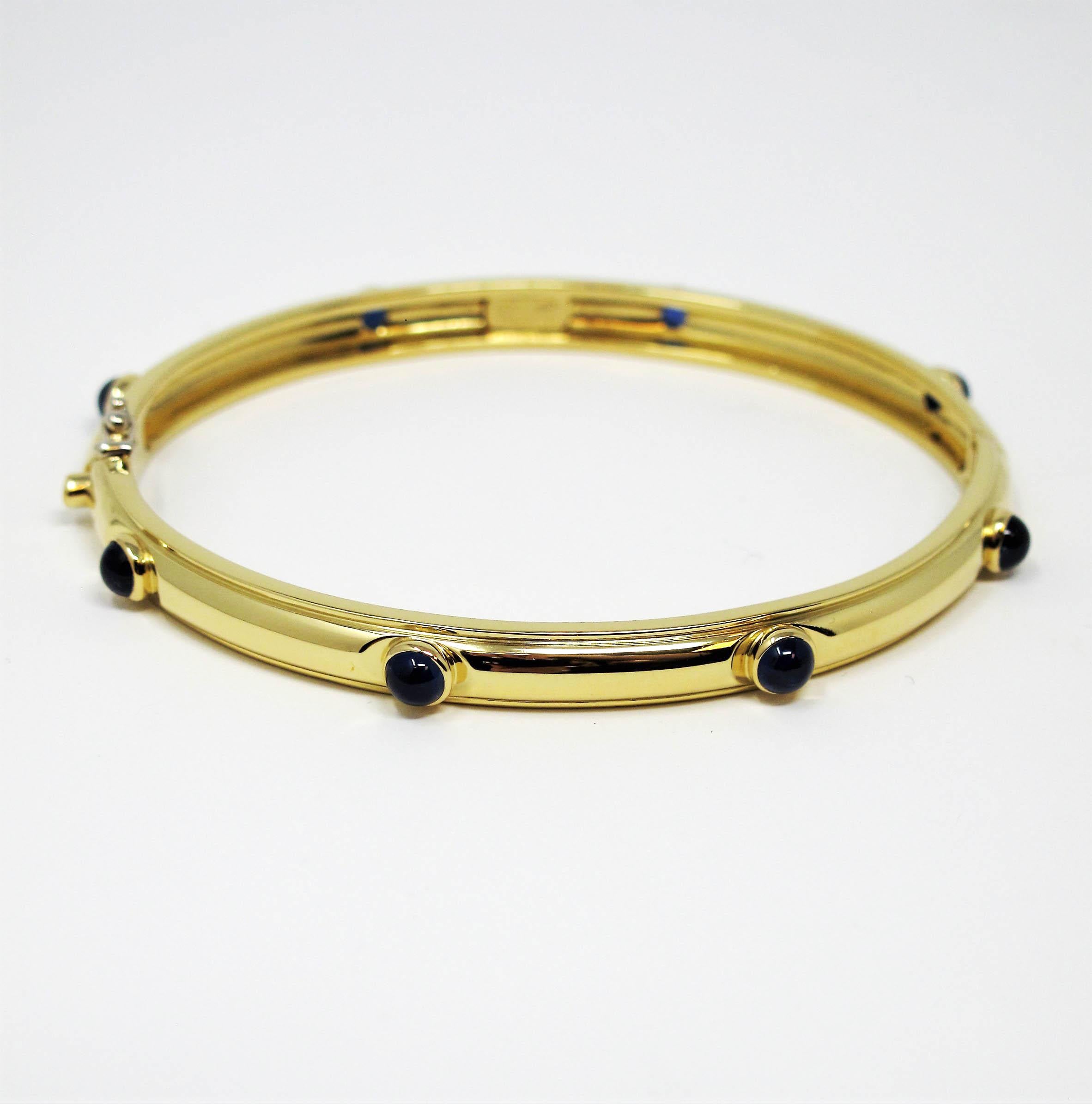 Gorgeous sapphire station bangle bracelet from Tiffany & Co. This simple, yet effortlessly timeless piece makes a chic statement on the wrist. With its clean lines, perfect symmetry, and flawless elegance, this bracelet will remain one of your