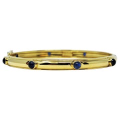 Tiffany & Co. 8 Cabochon Sapphire Hinged Bangle Bracelet 18 Karat Yellow Gold
