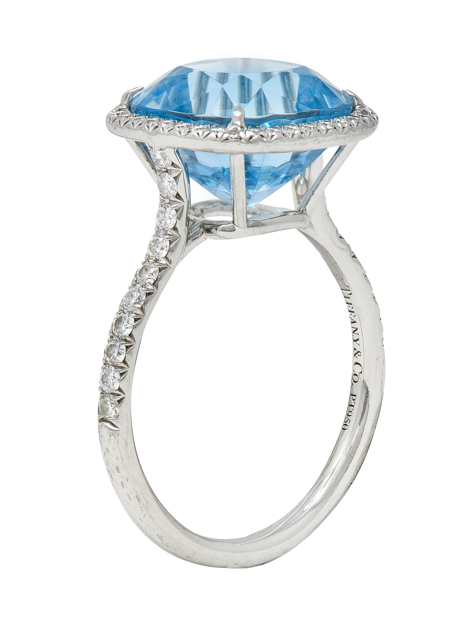 Featuring a cushion cut aquamarine weighing approximately 7.35 carats

Eye clean with saturated and uniform sky-blue color

With a round brilliant cut diamond halo and shoulder accents

Weighing in total approximately 0.85 carat with F/G color and