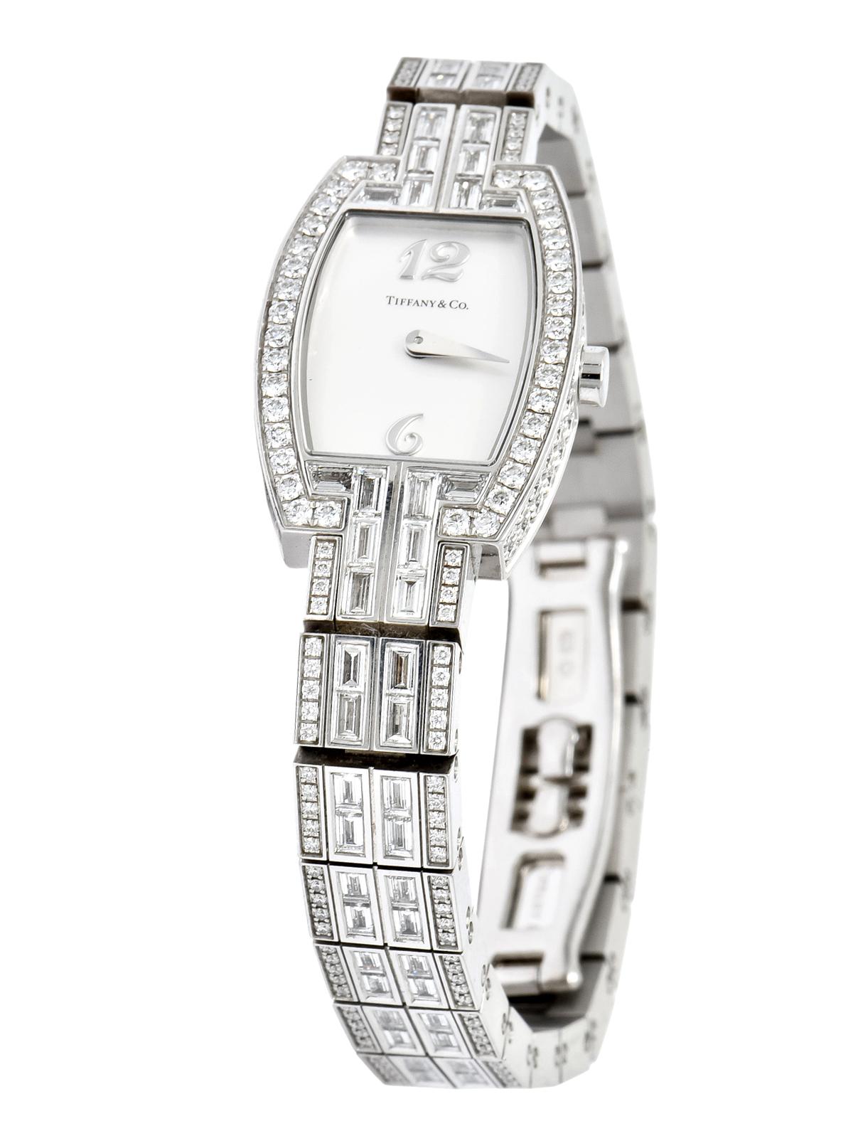 Tiffany & Co. Tonneau wristwatch set with 430 round brilliant and baguette diamonds weighing approximately 8.20 carats total

Diamonds are IF-SI1 clarity and G-H in color

Quartz Movement with Arabic numerals 

Mounted in 18 karat white gold

From