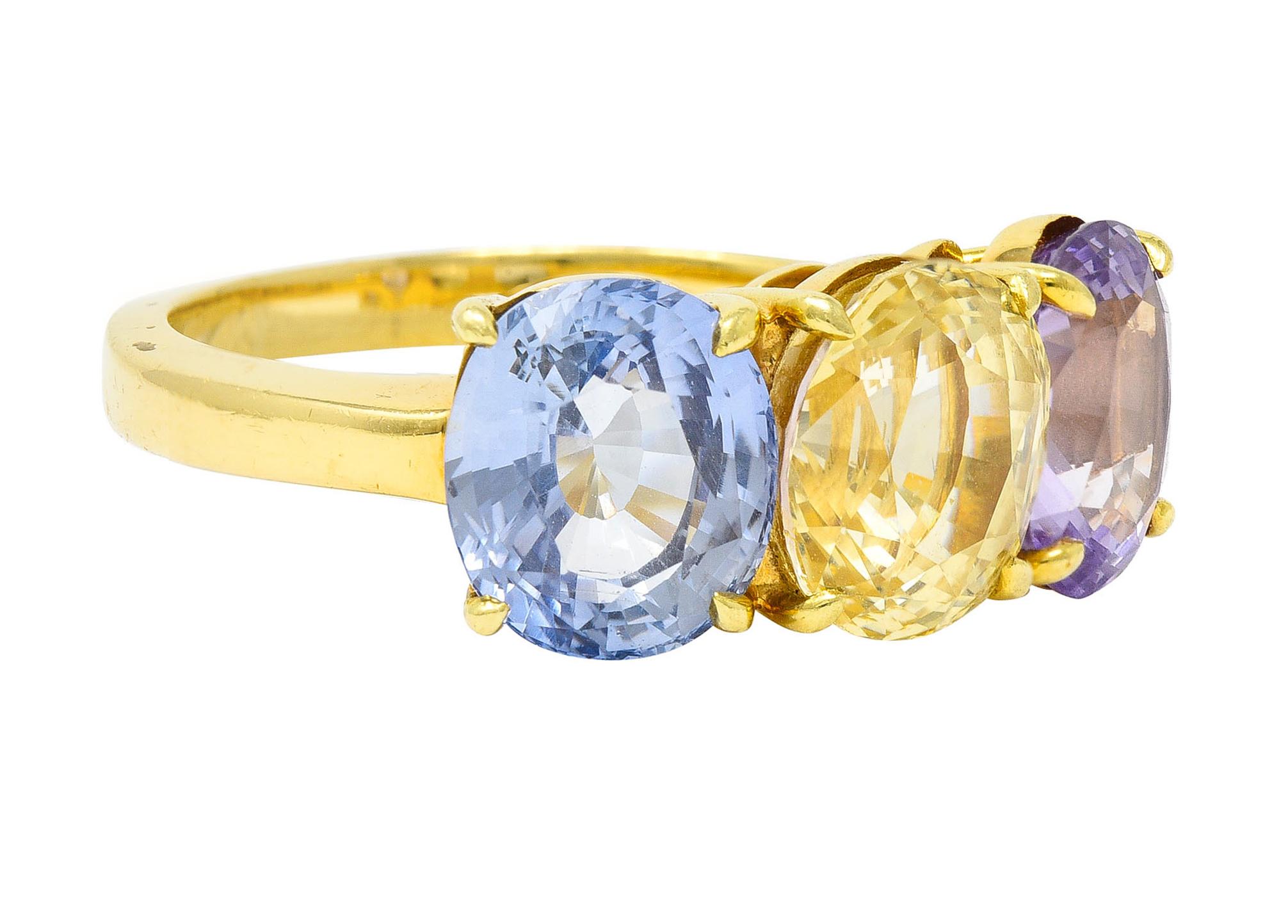 Three stone ring features basket set oval cut sapphires

Blue sapphire weighs approximately 2.85 carats

Yellow sapphire weighs approximately 3.41 carats

Lavender sapphire weighs approximately 2.53 carats

All are eye clean and very well matched in