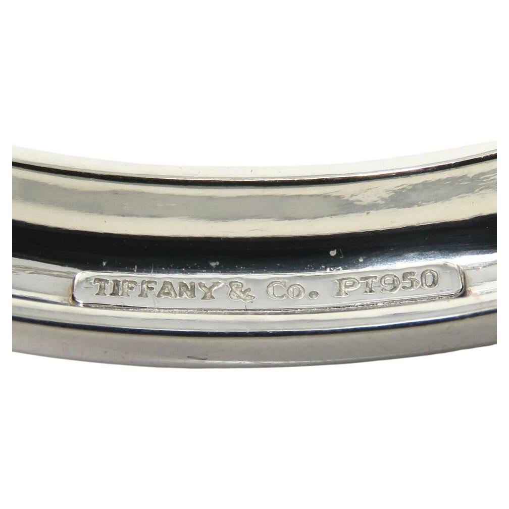 This authentic Tiffany diamond bracelet is substantial and absolutely fantastic quality! A diamond tennis bracelet is a time tested look that will always be in style! 
Diamonds approx 9.25ct TW, most about G and VS range

Bracelet 10mm wide. Inner