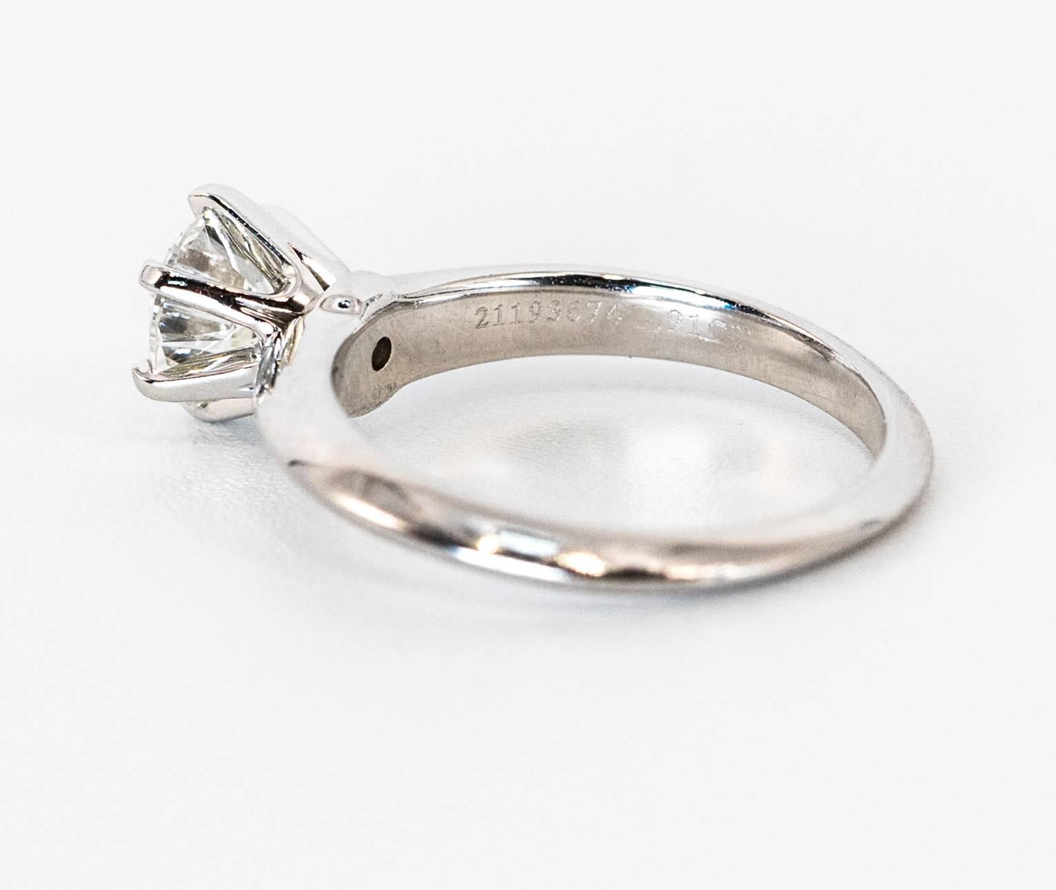 Tiffany & Co. Diamond Engagement Solitaire ring in platinum.
Features a .91 ct Center H color VS1 Clarity Round Brilliant. 
Original box and papers. 

Center Diamond: .91 ct Round Brilliant , H VS1 
Ring Size: 4 3/4 - Can re-size easily
