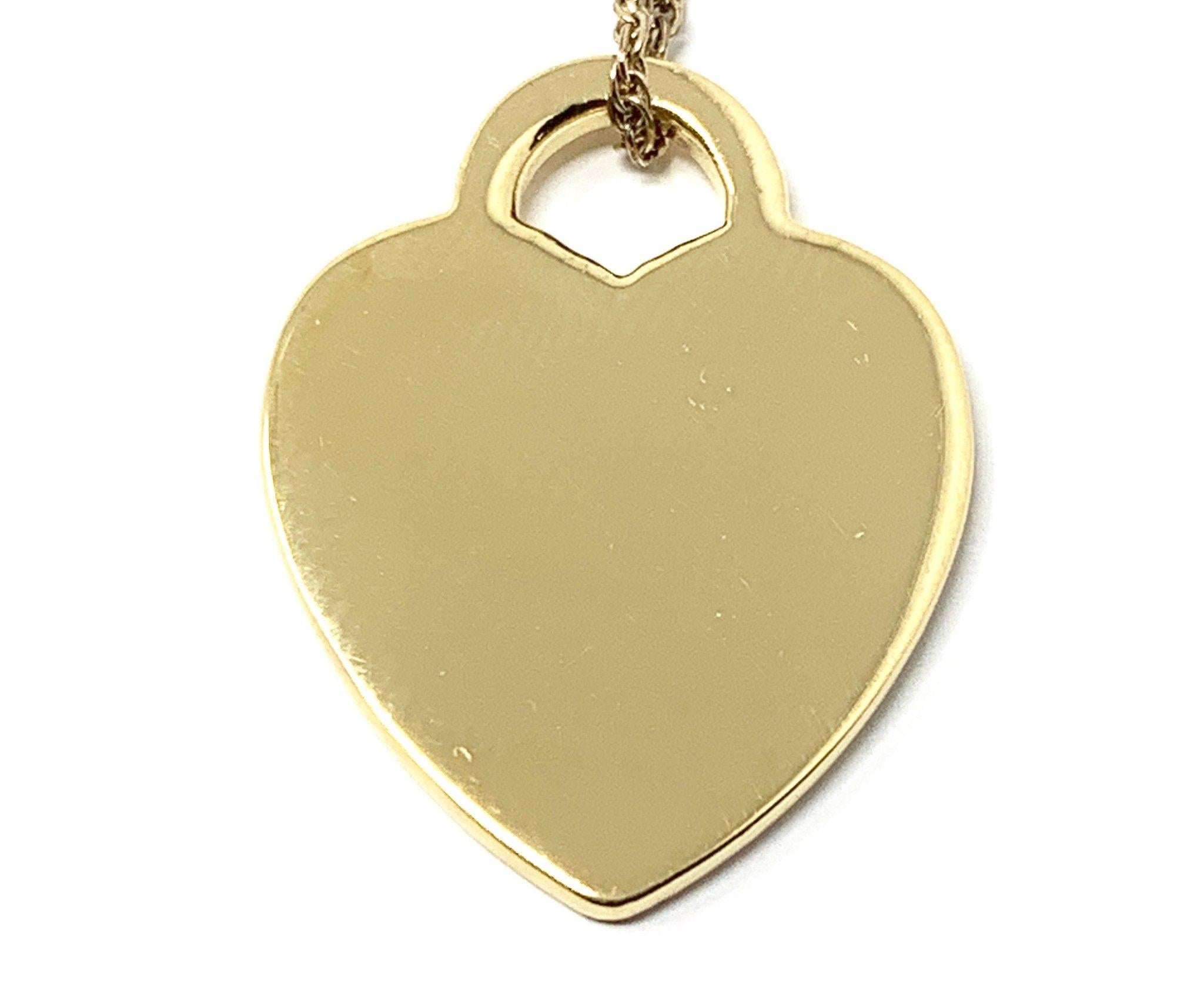 (Item Description) 
Brand - Tiffany&Co.
Gender - Unisex
Condition - Pre-Owned 
Style - Heart Pendant 
Metals - 925 Silver 
Coating - 24k Yellow Gold
Weight - 4.0 Grams
Hall marks - Please Return to /Tiffany&co NY
length -1 Inch Aprox
Tiffany Jewelry