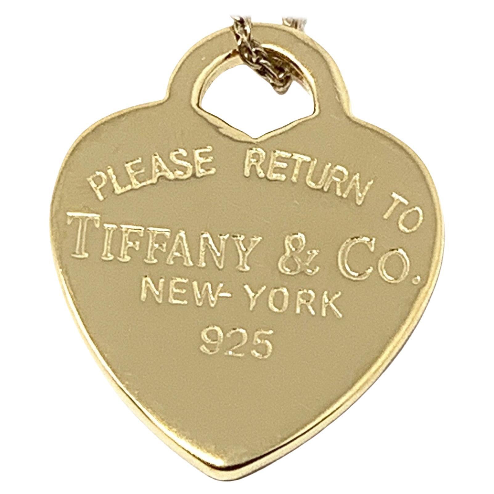 (Item Description) 
Brand - Tiffany&Co.
Gender - Unisex
Condition - Pre-Owned 
Style - Heart Pendant 
Metals - 925 Silver 
Coating - 24k Yellow Gold
Weight - 4.0 Grams
Hall marks - Please Return to /Tiffany&co NY
length -1 Inch Aprox
Tiffany Jewelry