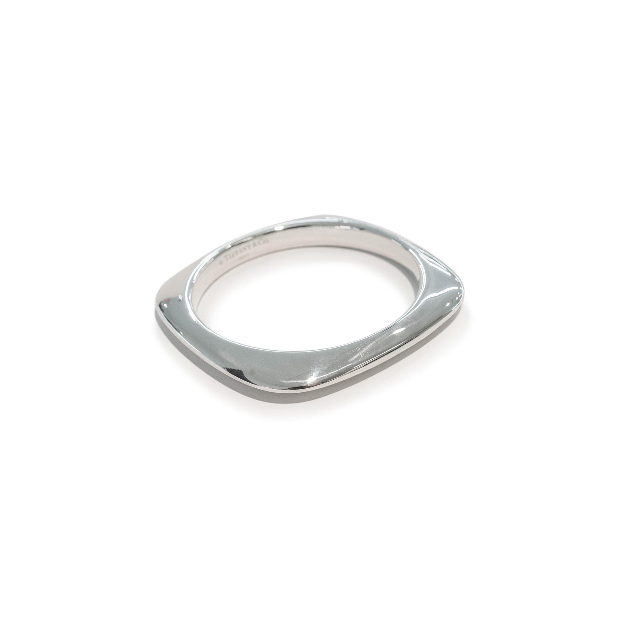 Brand: Tiffany & Co.

Material: 925 Sterling Silver

Length: 7.75 inches

Width: 9.00mm

Weight: 61.80 grams
Silver bangle bracelet. Engraved with 