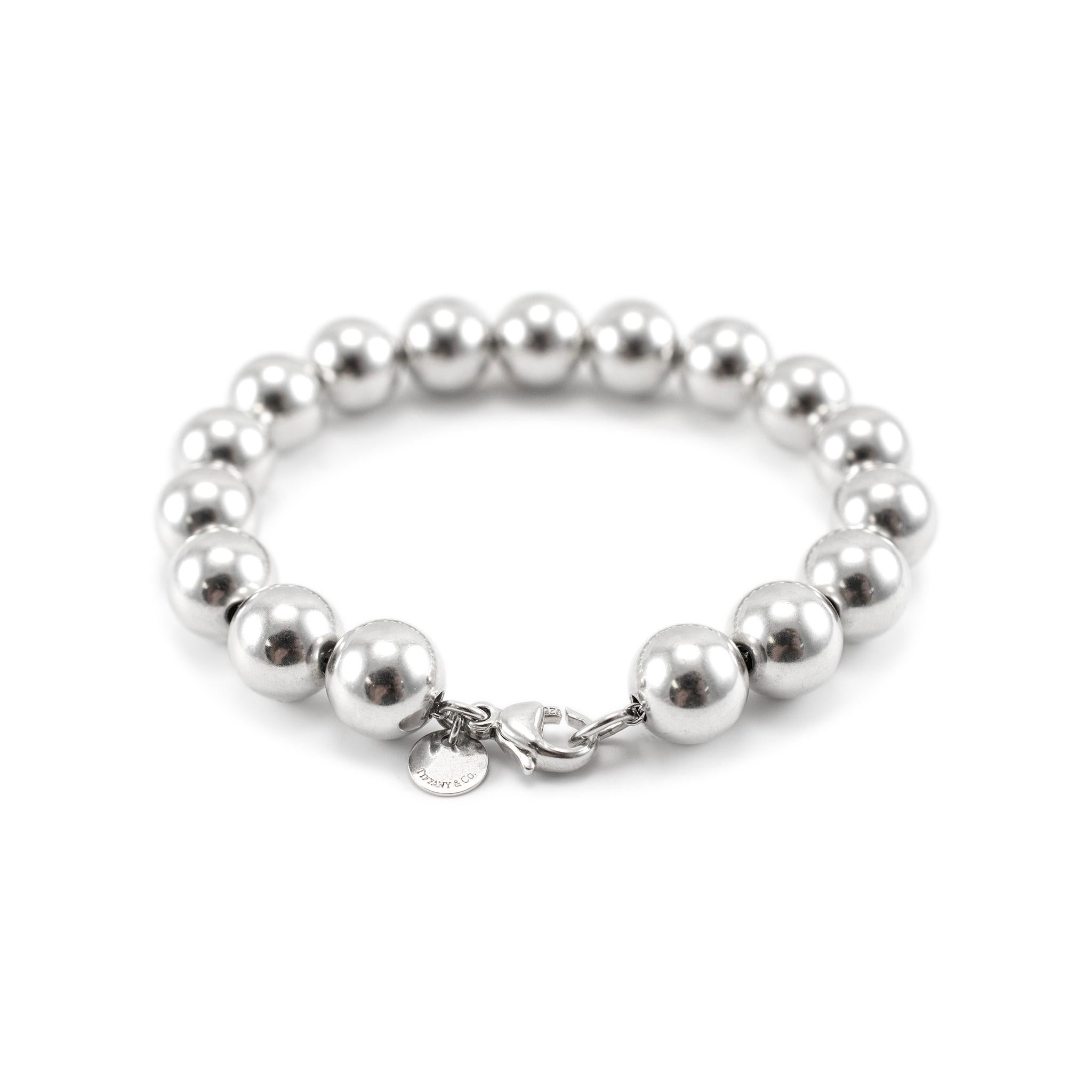 Brand: Tiffany & Co.

Gender: Ladies

Metal Type: 925 Sterling Silver

Length:  6.00 inches 

Width: 10.00 mm

Weight: 18.12 Grams

Ladies designer made polished silver, bead bracelet. The metal was tested and determined to be 925 (STERLING) silver.