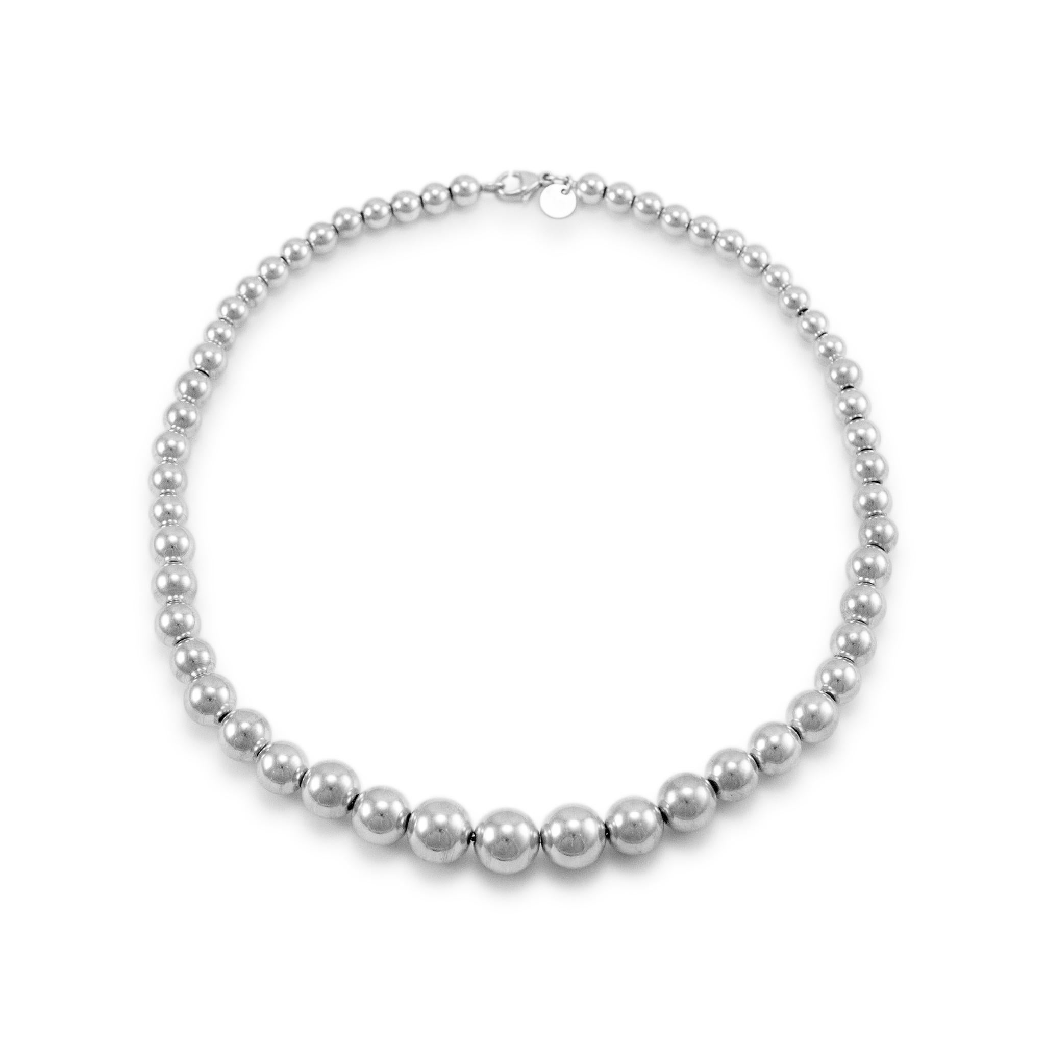 Brand: Tiffany & Co.

Gender: Ladies

Metal Type: 925 Sterling Silver 

Length:  15.00 inches 

Width: 11.00 mm tapering to 6.00 mm

Weight: 27.78 Grams

Silver bead necklace. The metal was tested and determined to be 925 (STERLING) silver. Engraved