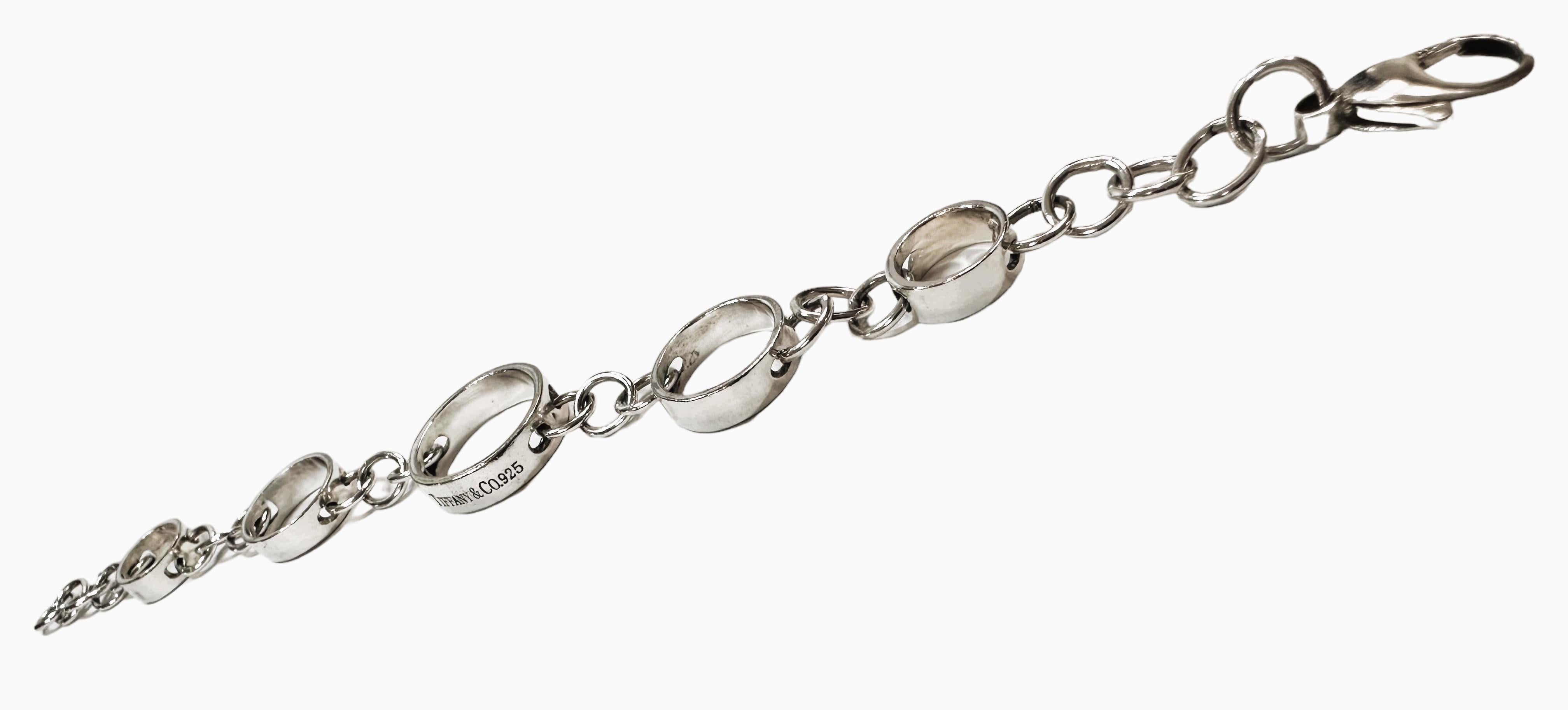 This is a very nice pre-owned Tiffany bracelet.  It is adjustable and can go from 7 to 8 inches.  It comes with a Tiffany Pouch and Box.   It is stamped 