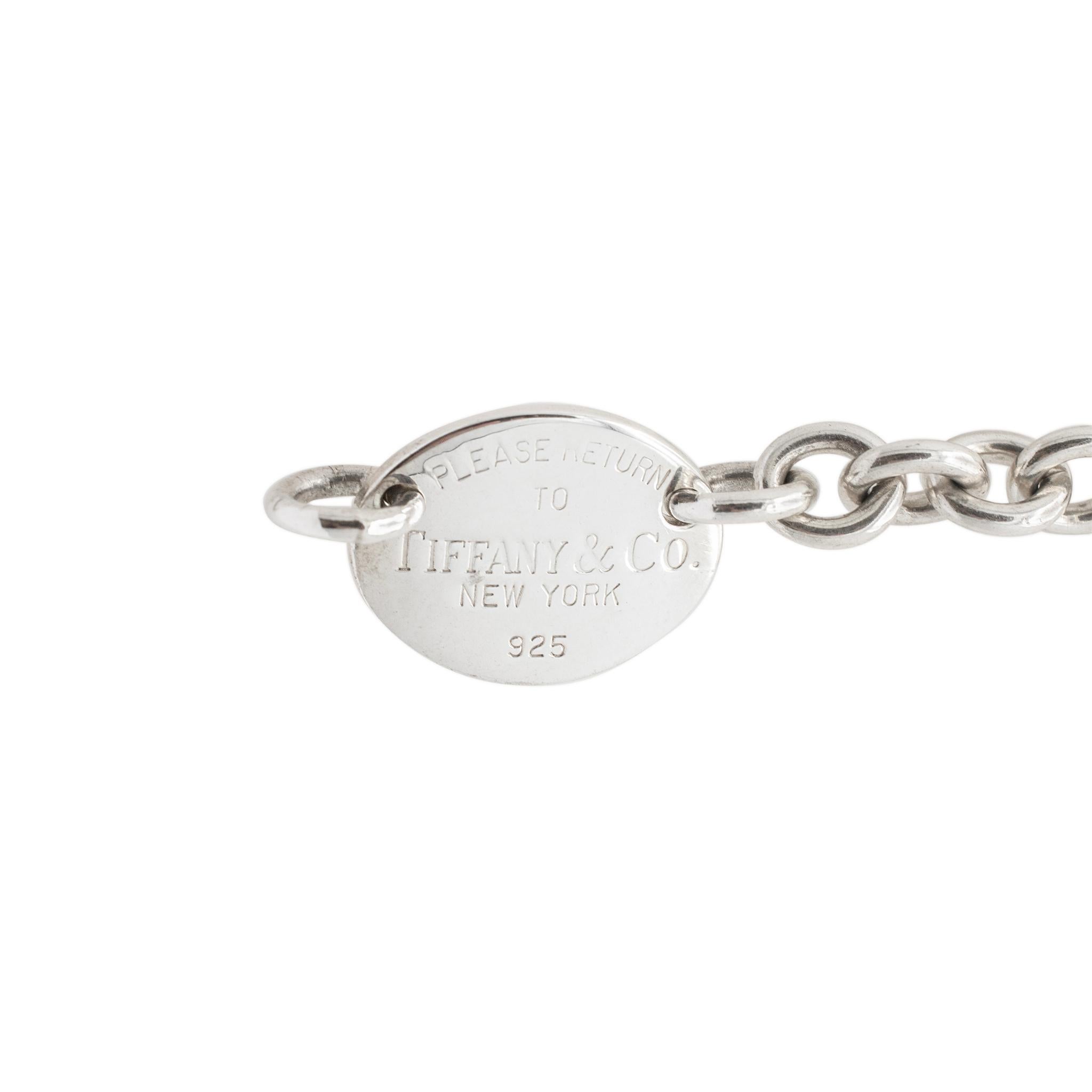 Brand: Tiffany & Co.

Gender: Ladies

Metal Type: 925 Sterling Silver

Length: 15.00 Inches

Links Width: 7.80 mm

Pendant measure: 18.00mm x 22.50mm

Weight: 2.20 grams

Pre-owned in excellent condition. Might shows minor signs of wear.

Silver