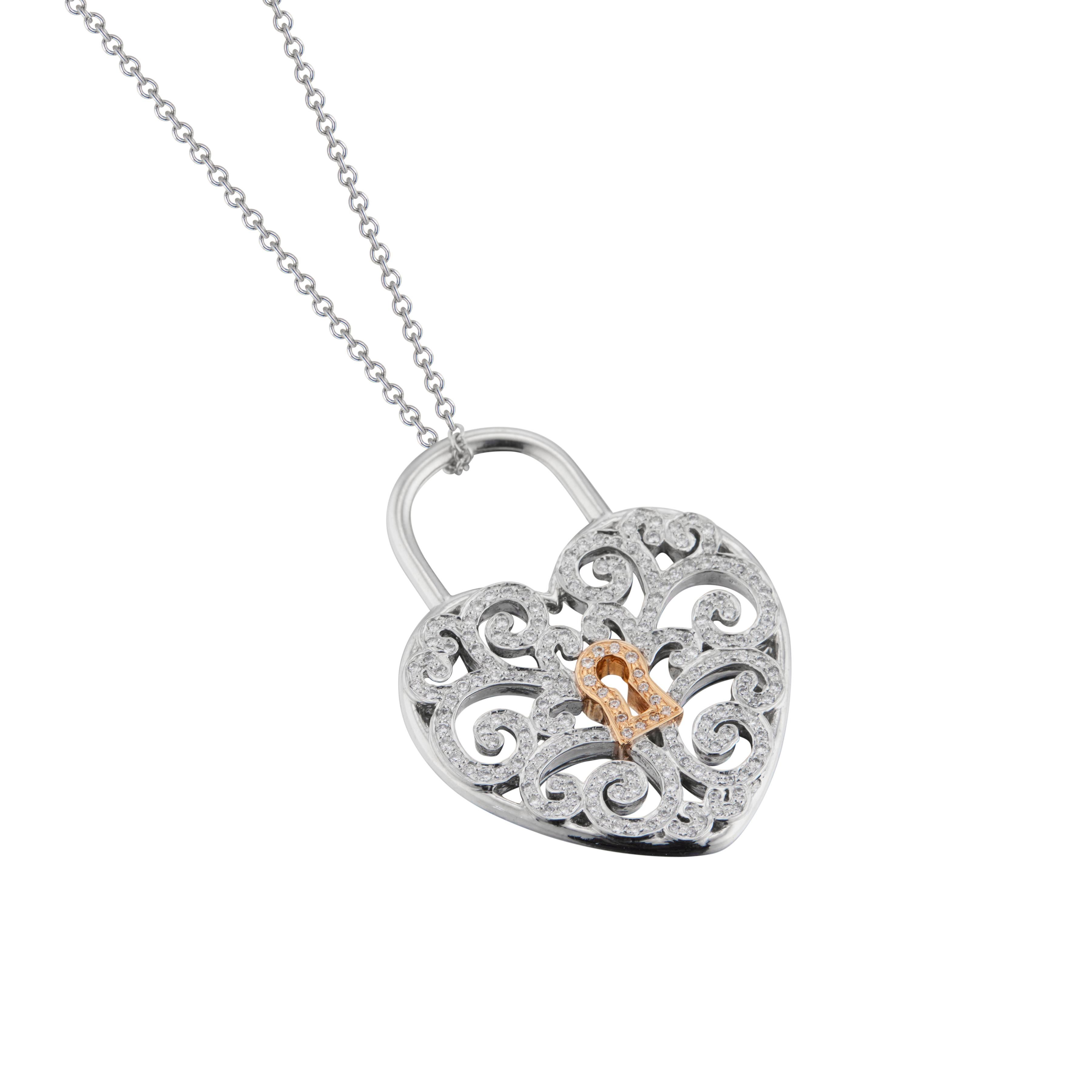 Tiffany & Co Enchant diamond heart lock pendant necklace in platinum with 18k rose gold lock center and 195 round brilliant cut diamonds. 16 inch 18k white gold chain.

195 round brilliant cut diamonds, G VS approx. .95cts 
Platinum 
18k rose